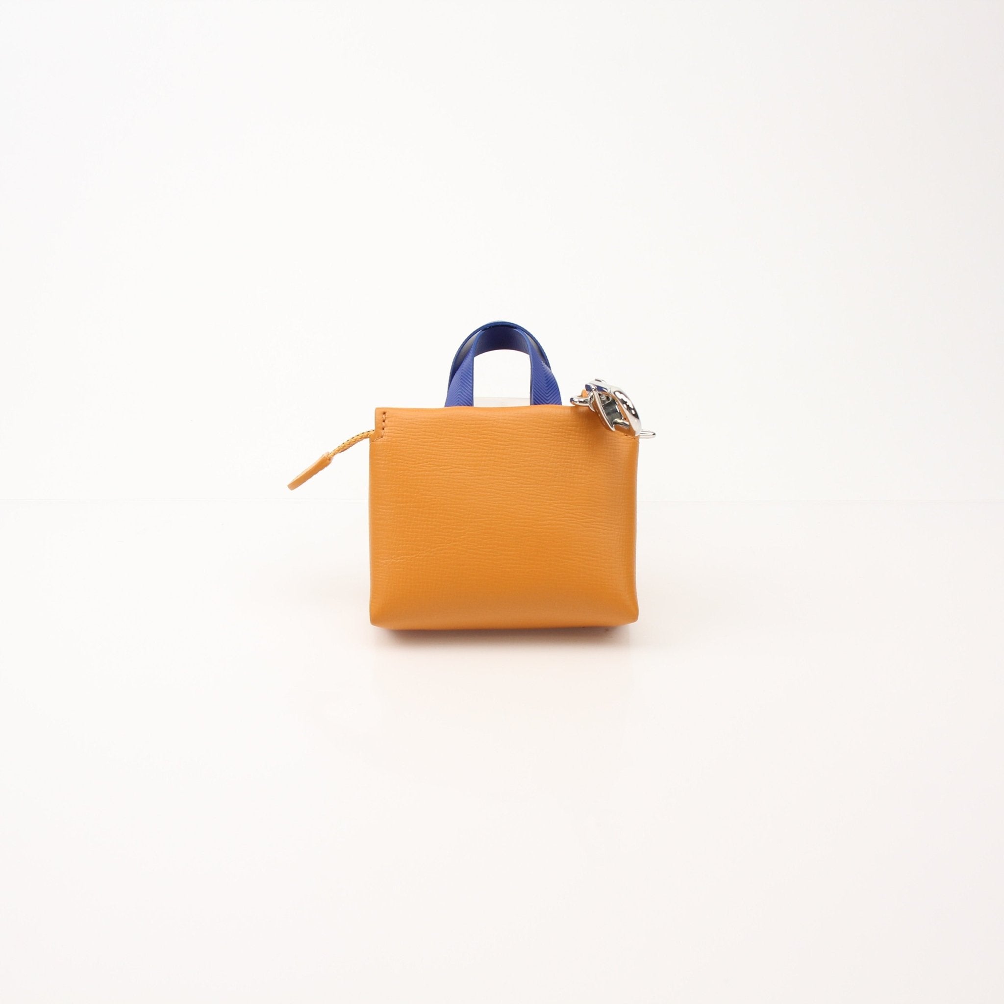 Louis Vuitton Mini Tote Charm Bag Charm accessory by Gold & Beyond, featuring gold-tone metal and detailed Louis Vuitton branding.