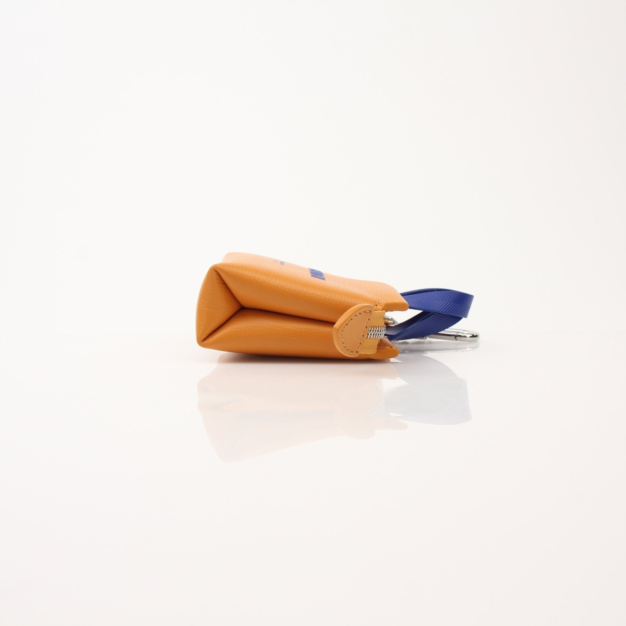 Louis Vuitton Mini Tote Charm Bag Charm accessory with gold accents, featuring iconic branding and detailed design.