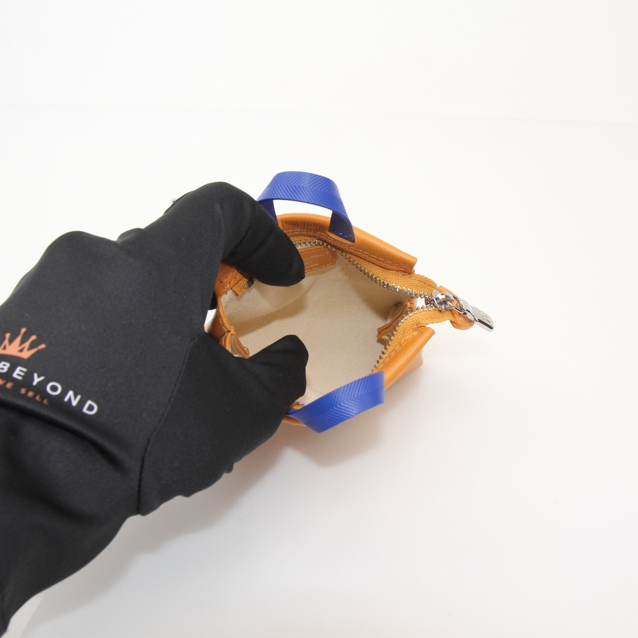 Louis Vuitton Mini Tote Charm Bag Charm accessory with gold accents, featuring detailed LV logo and stylish design.
