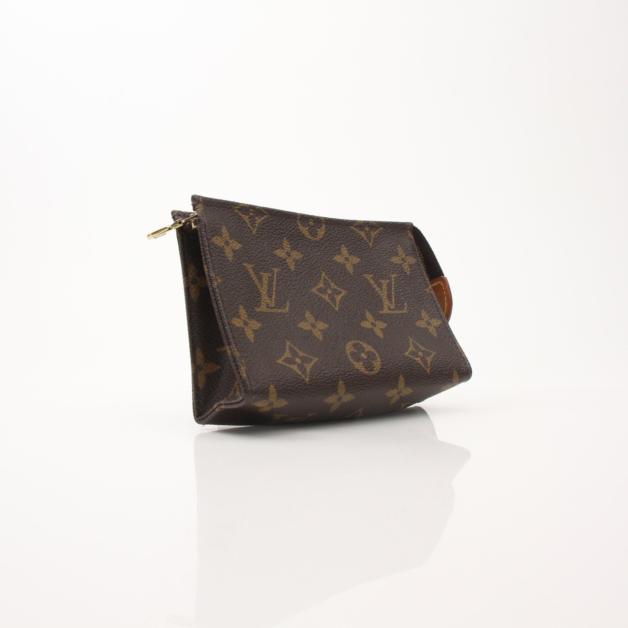 Louis Vuitton Toiletry Pouch 15 vanity case in Monogram canvas with leather trim, shown open with interior compartments.