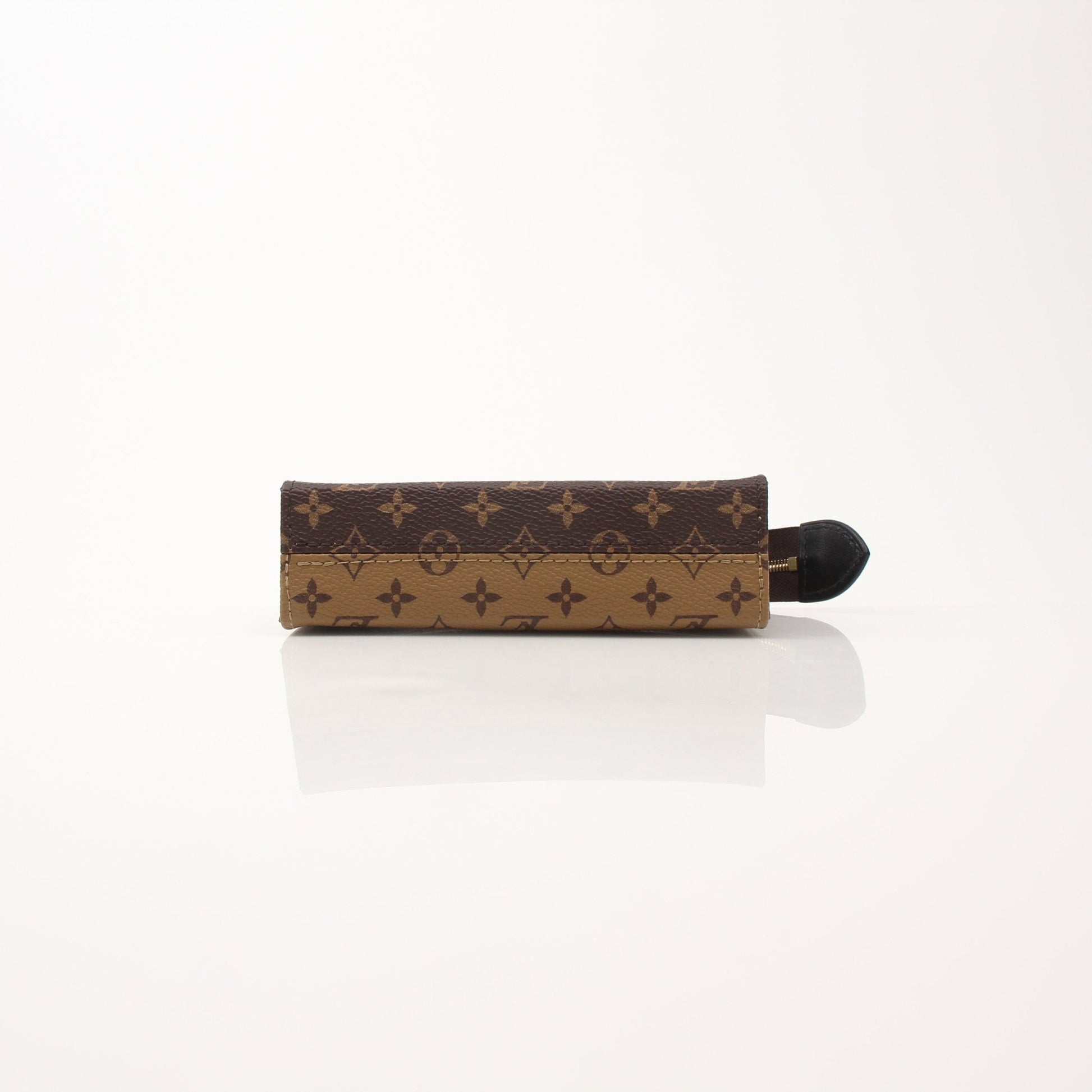 Louis Vuitton Toiletry Pouch 15 vanity case in brown monogram canvas with leather trim and gold hardware, compact and stylish for travel.
