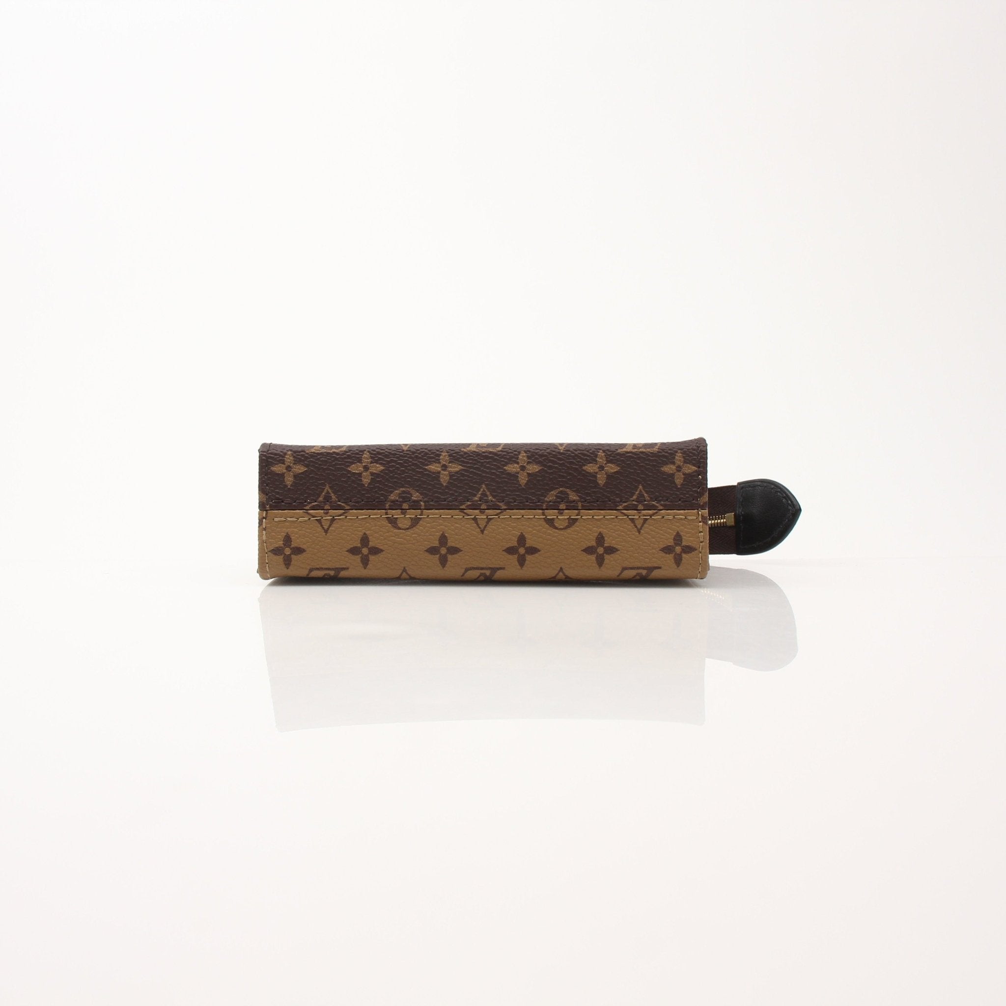 Louis Vuitton Toiletry Pouch 15 vanity case in brown monogram canvas with leather trim and gold hardware, compact and stylish for travel.