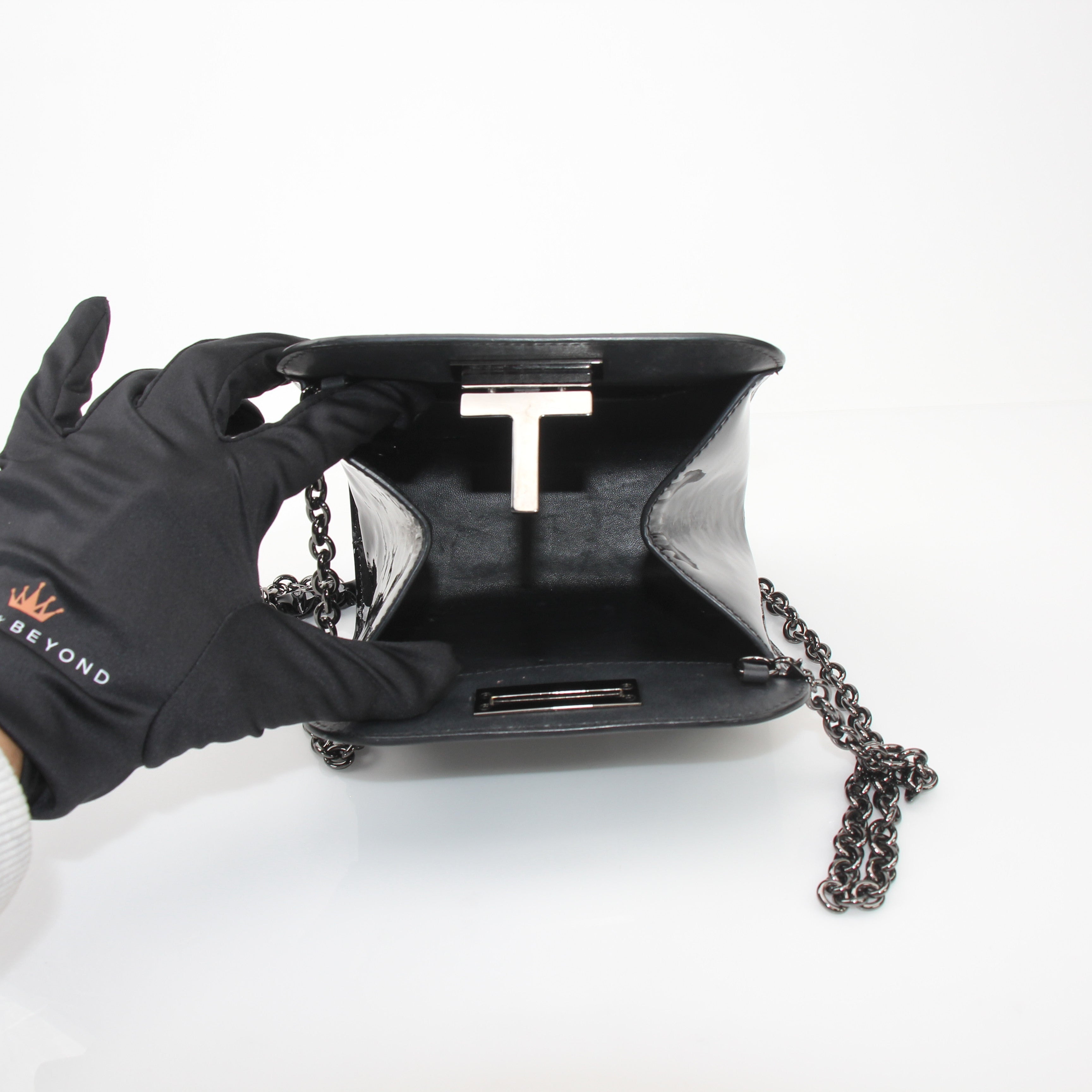 Tom Ford Black Cosmo handbag by Gold & Beyond, stylish leather handbag with gold-tone accents and sleek design.