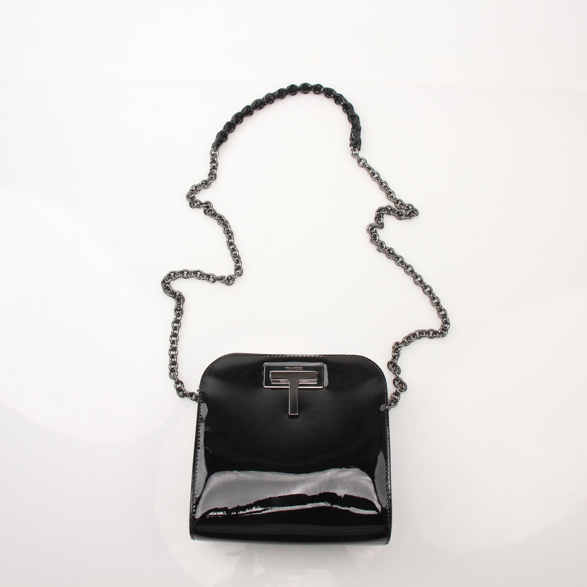 Tom Ford Black Cosmo handbag by Gold & Beyond, showing sleek design and luxurious leather exterior.