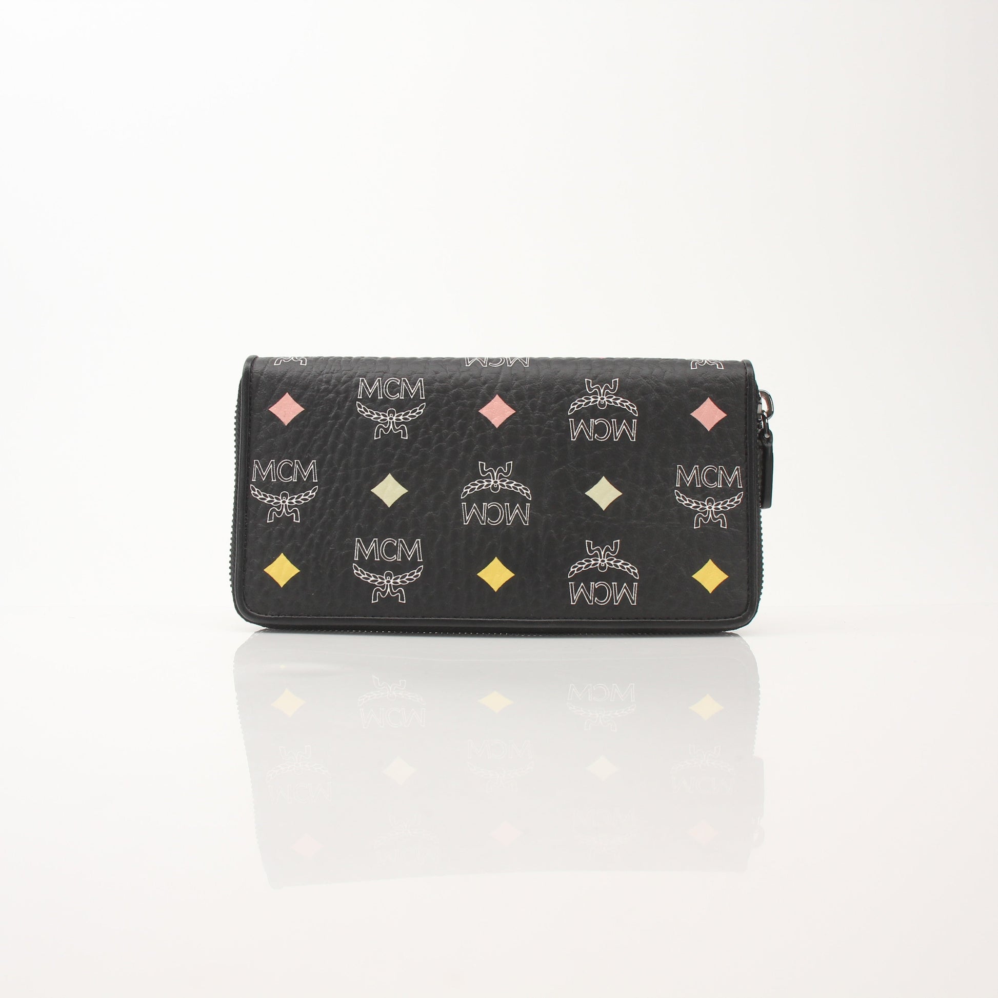 Gold & Beyond MCM Visetos Diamond Spectrum zip around wallet with geometric design and gold-tone zipper detailing.