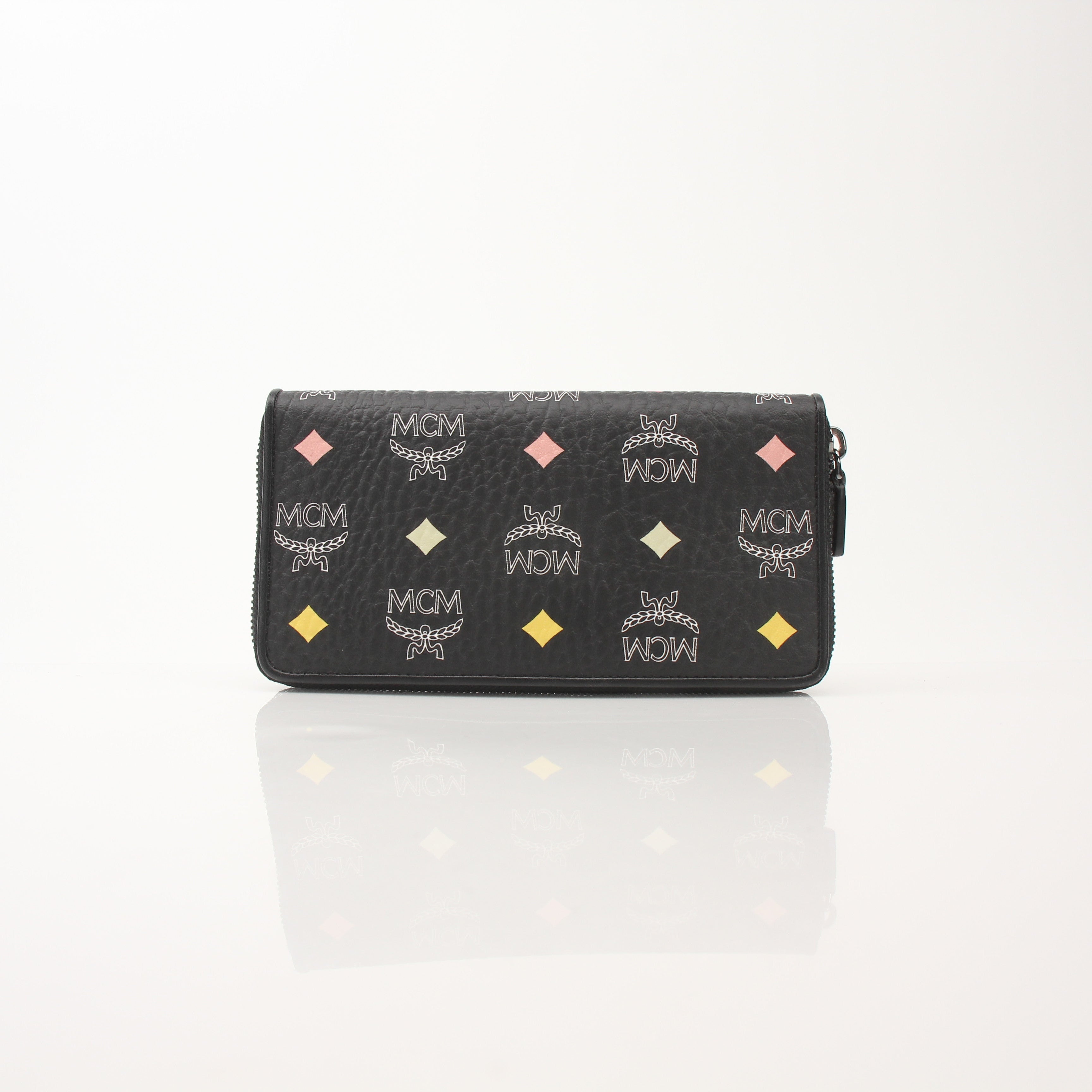 Gold & Beyond MCM Visetos Diamond Spectrum zip around wallet with geometric design and gold-tone zipper detailing.