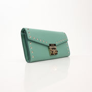 Gold & Beyond MCM Millie Mint Wallet on Chain with gold-tone hardware and textured leather, showing the compact design and chain strap.