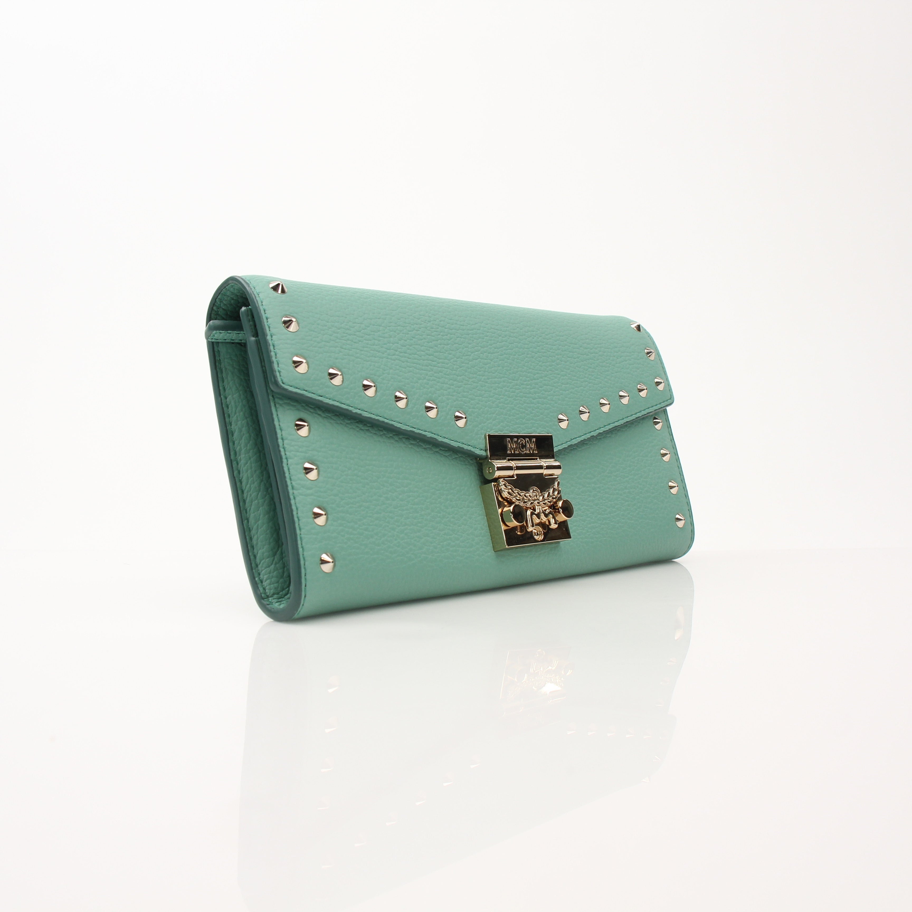 Gold & Beyond MCM Millie Mint Wallet on Chain with gold-tone hardware and textured leather, showing the compact design and chain strap.