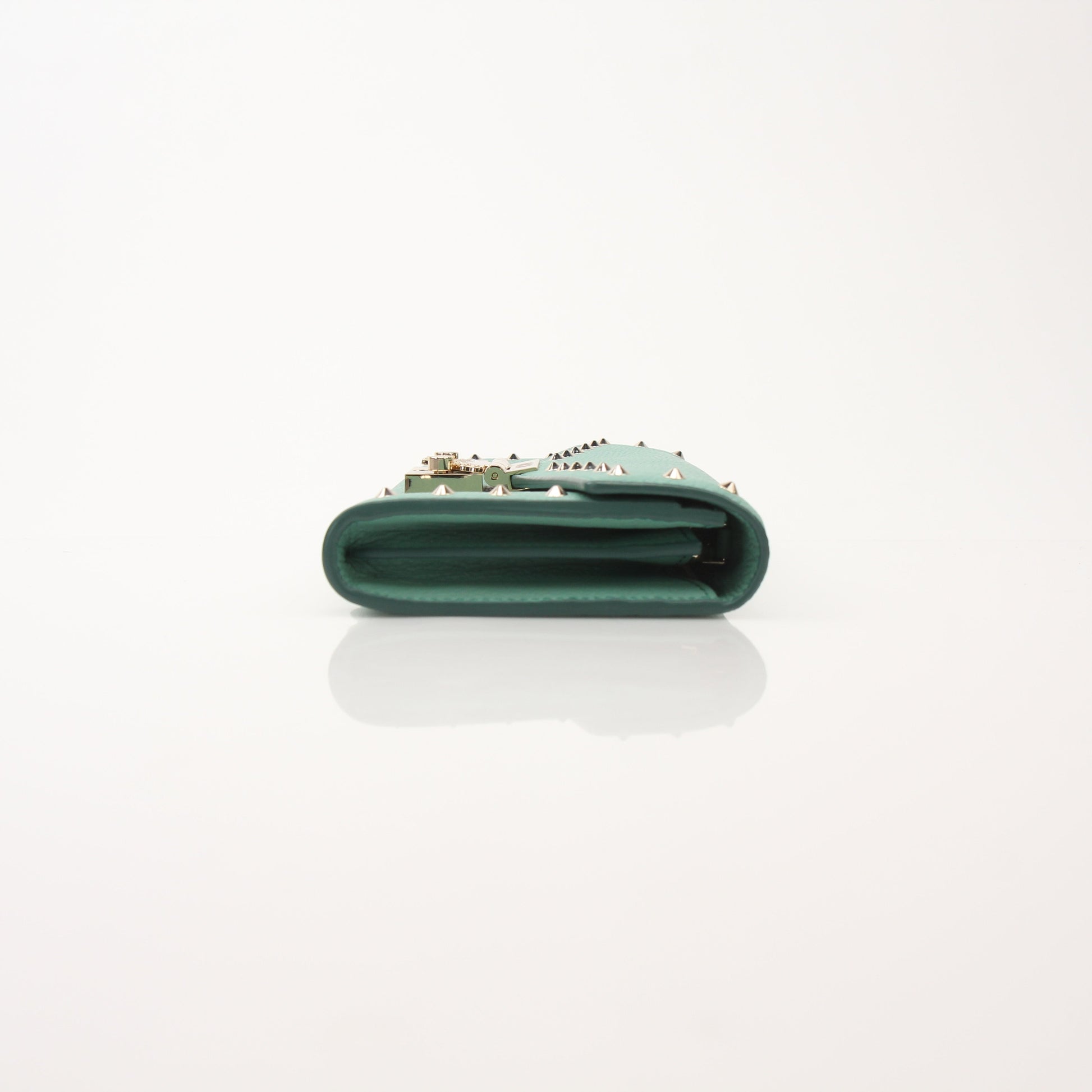 MCM Millie Mint Wallet on Chain with gold hardware, chain strap, and quilted leather texture, designed by Gold & Beyond
