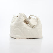 Christian Dior Latte Macrocannage Toujours tote handbag in beige with gold accents and structured design.