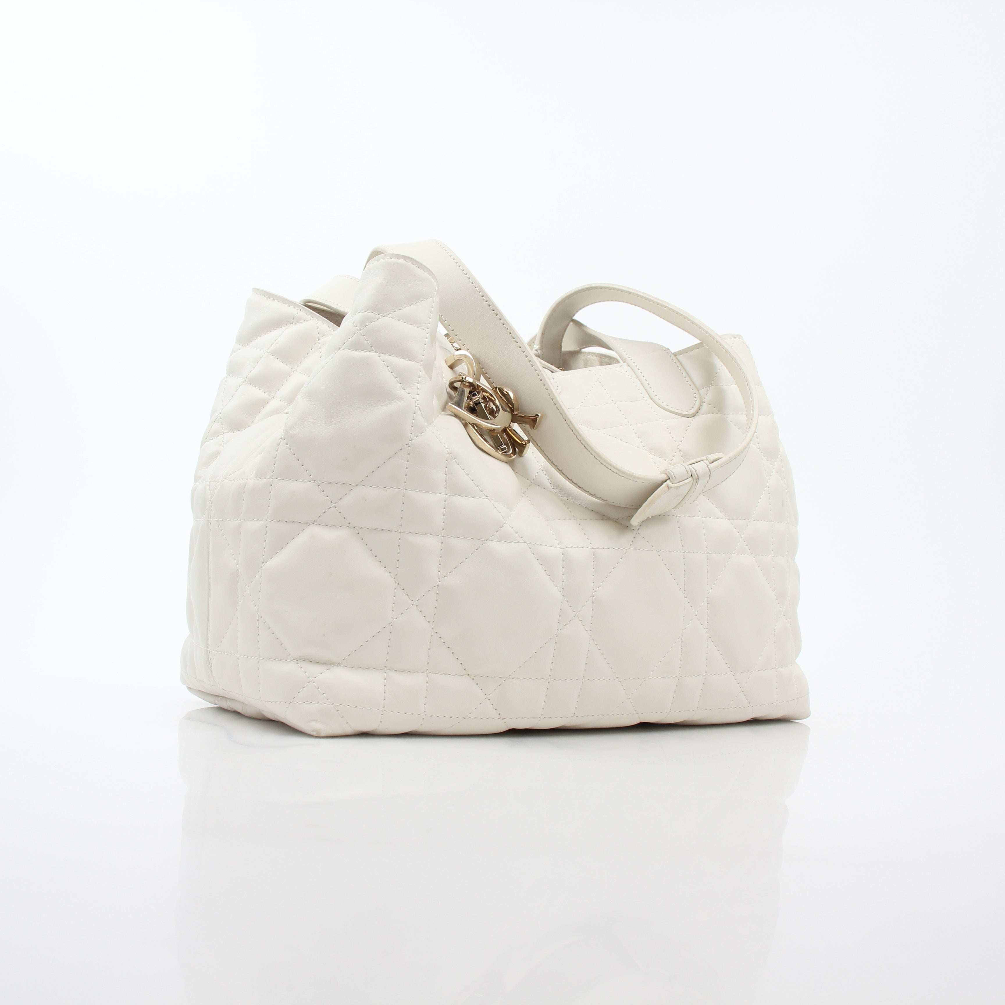 Christian Dior Latte Macrocannage Toujours tote handbag in beige with gold accents and structured design.