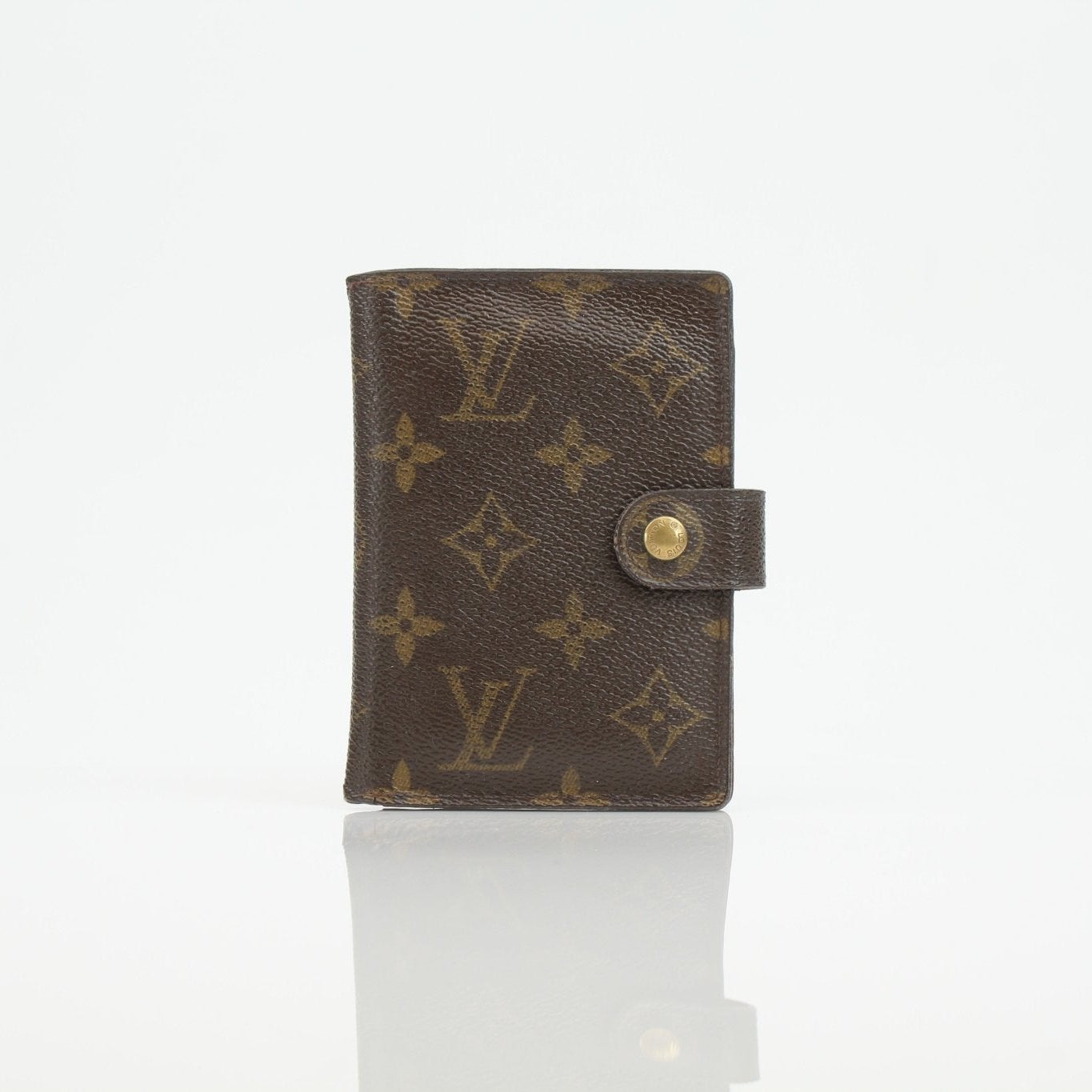 Louis Vuitton Monogram Agenda Cover wallet with gold accents, featuring the iconic LV monogram pattern and structured leather design.