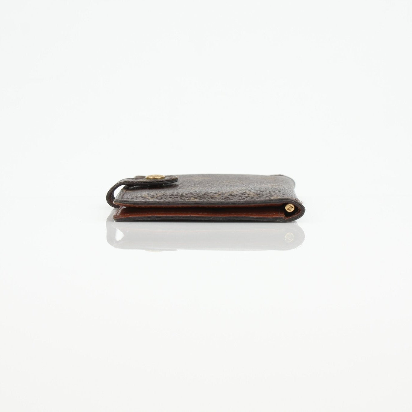 Louis Vuitton Monogram Agenda Cover wallet with gold accents and textured monogram design, front view showing branding and craftsmanship.