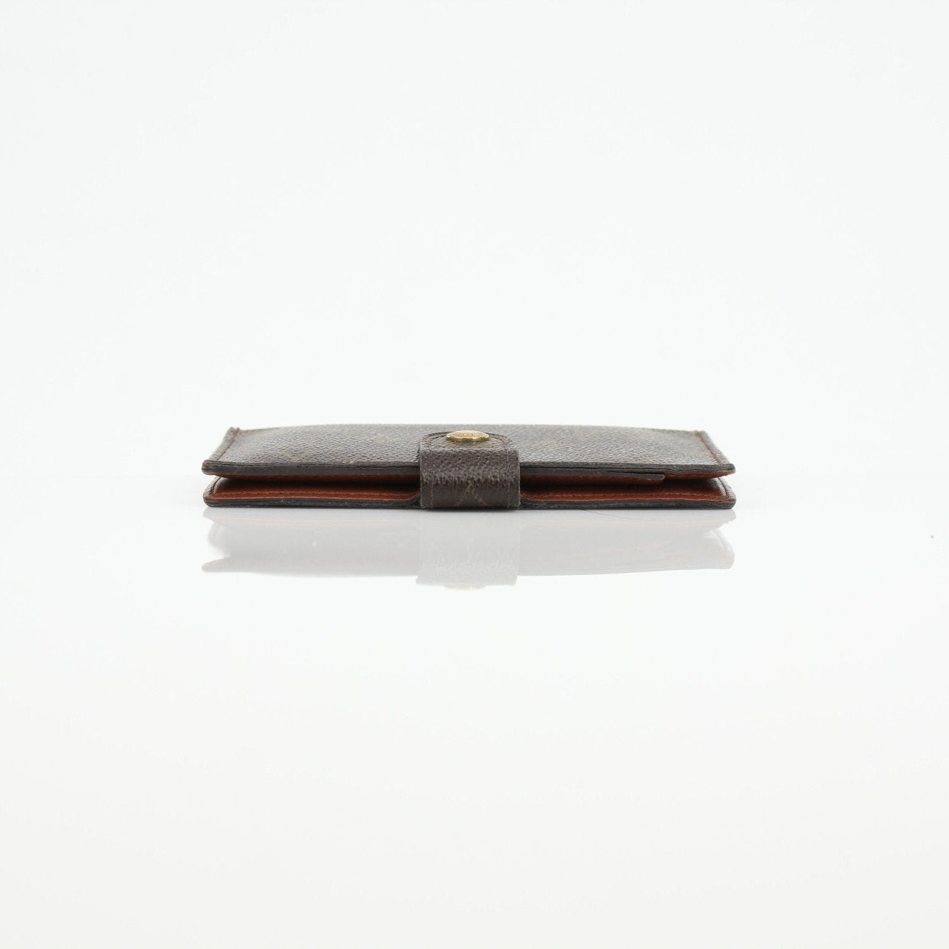 Louis Vuitton Monogram Agenda Cover wallet in coated canvas with gold-tone hardware and interior card slots.