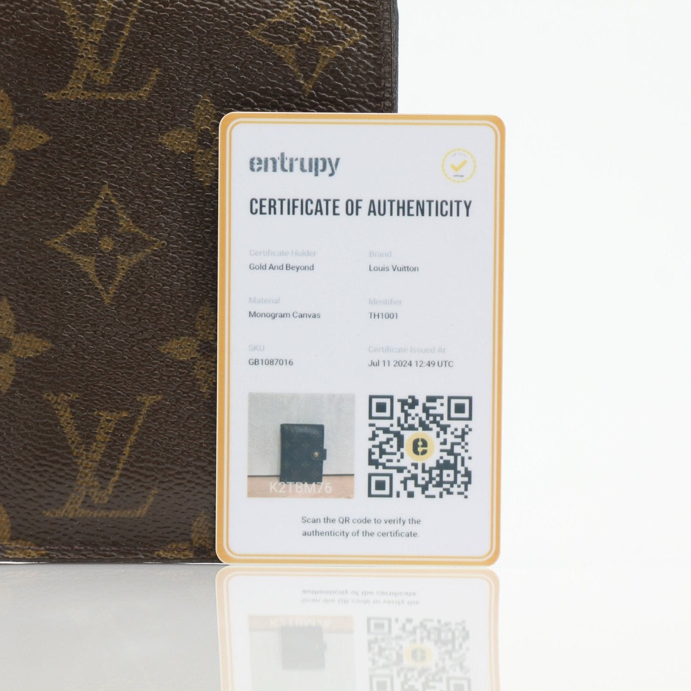 Louis Vuitton Monogram Agenda Cover wallet with gold accents and signature monogram pattern, showcasing luxury leather craftsmanship.