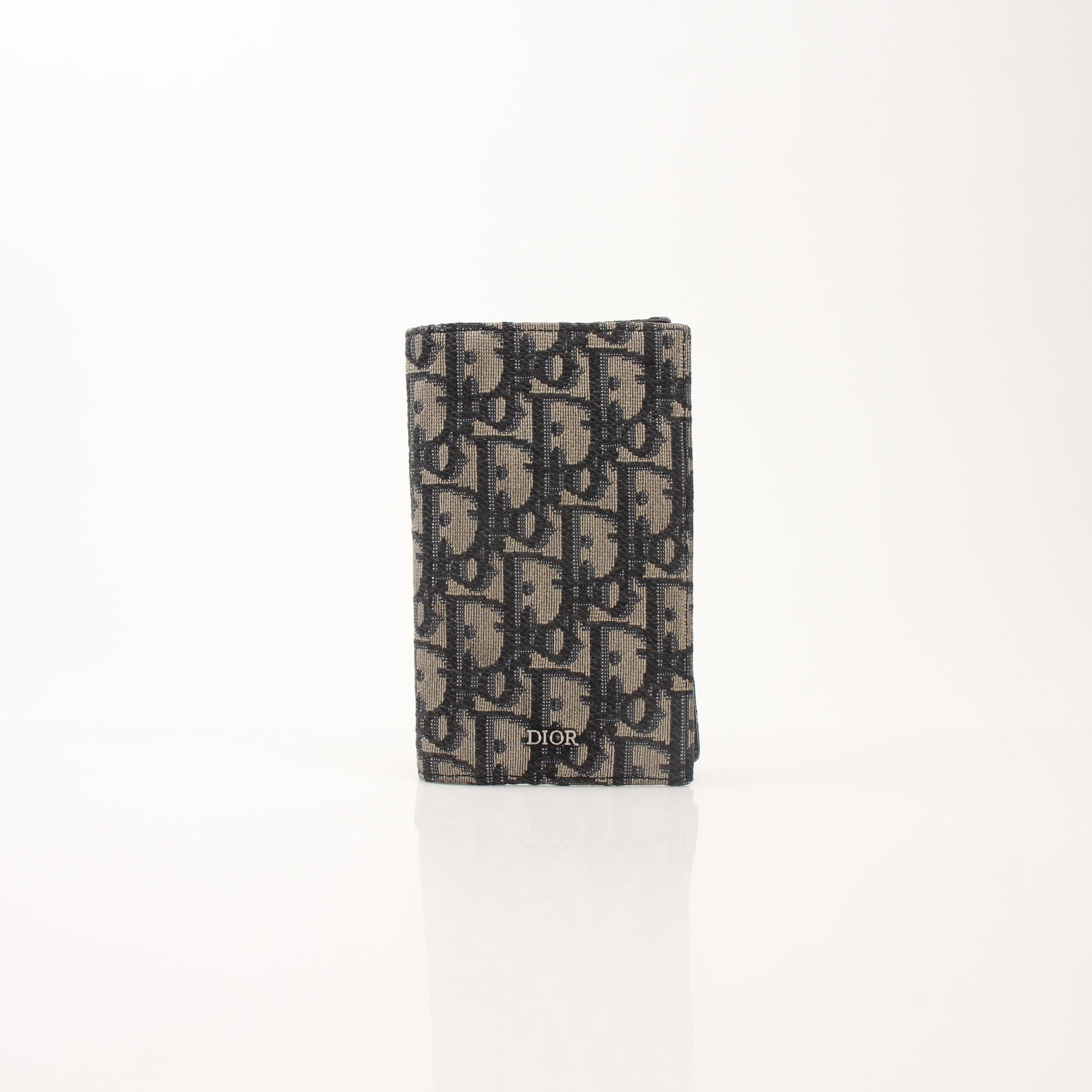 Christian Dior Oblique Blue Bifold Wallet with gold accents, featuring the signature Dior pattern and multiple card slots.