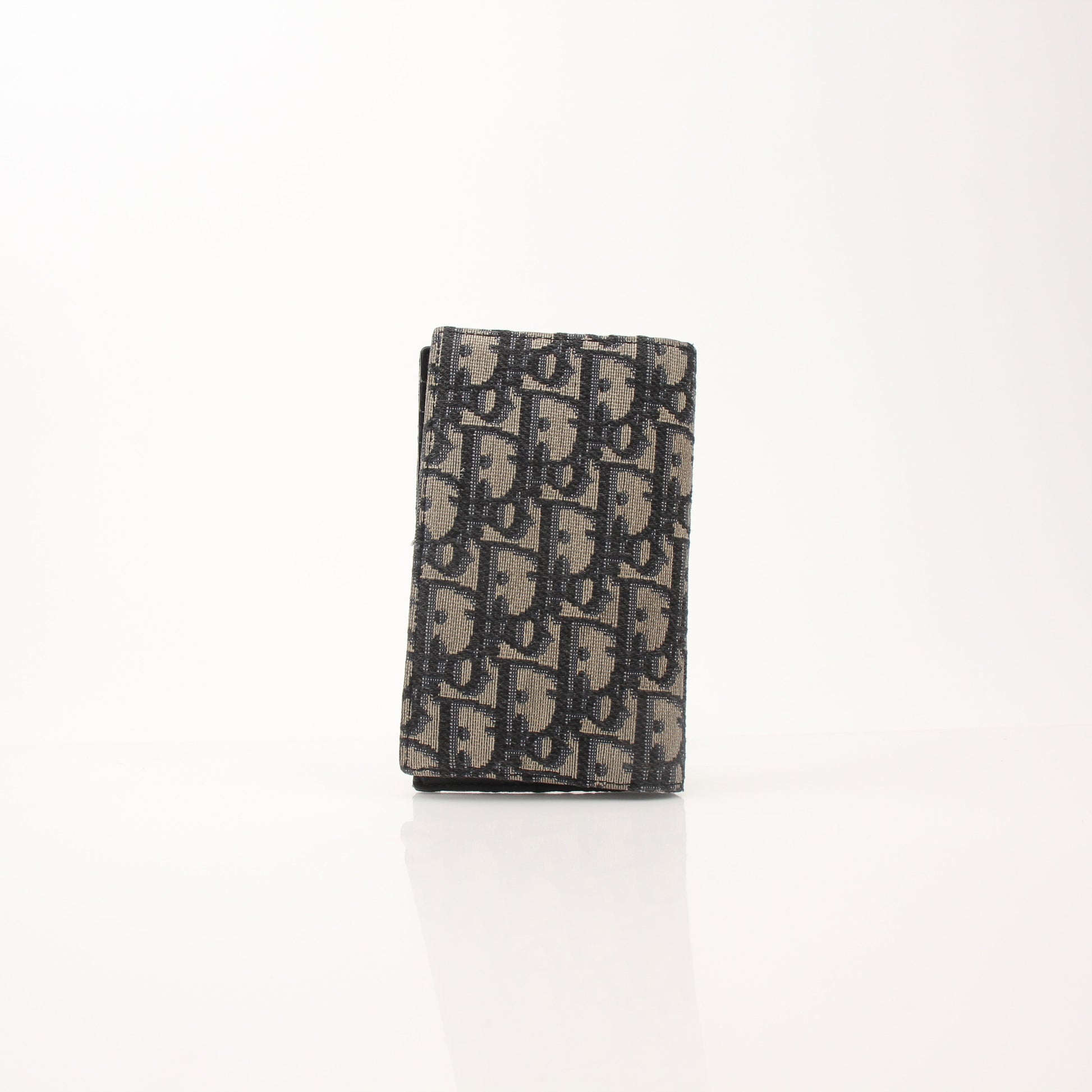Christian Dior Oblique blue bifold wallet with gold accents, featuring multiple card slots and a sleek, compact design.