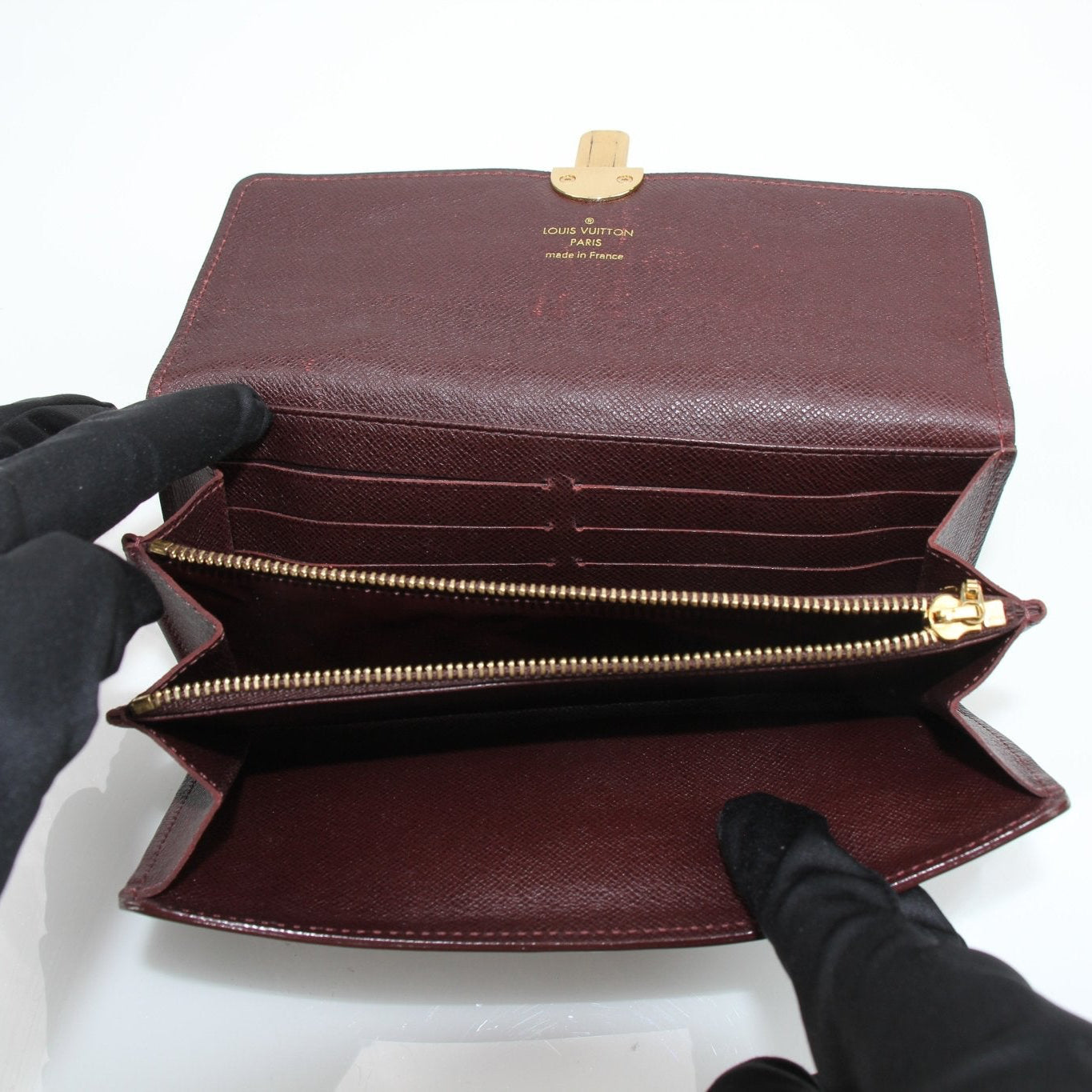Louis Vuitton Sarah Monogram Wallet with gold-tone hardware and multiple card slots, featuring classic Monogram canvas design.