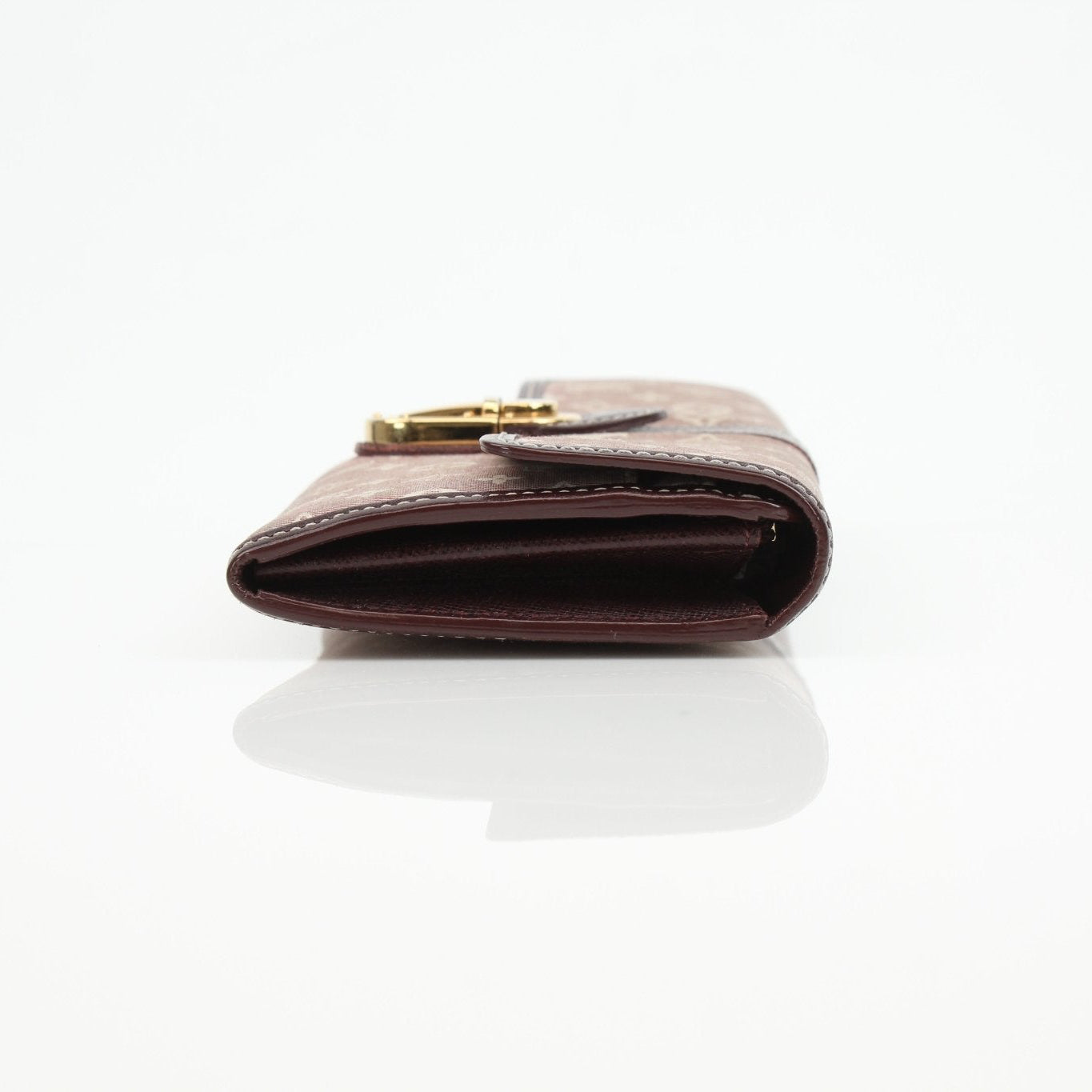 Louis Vuitton Sarah Monogram Wallet showing its classic monogram canvas, zipper closure, and compact design for everyday use.
