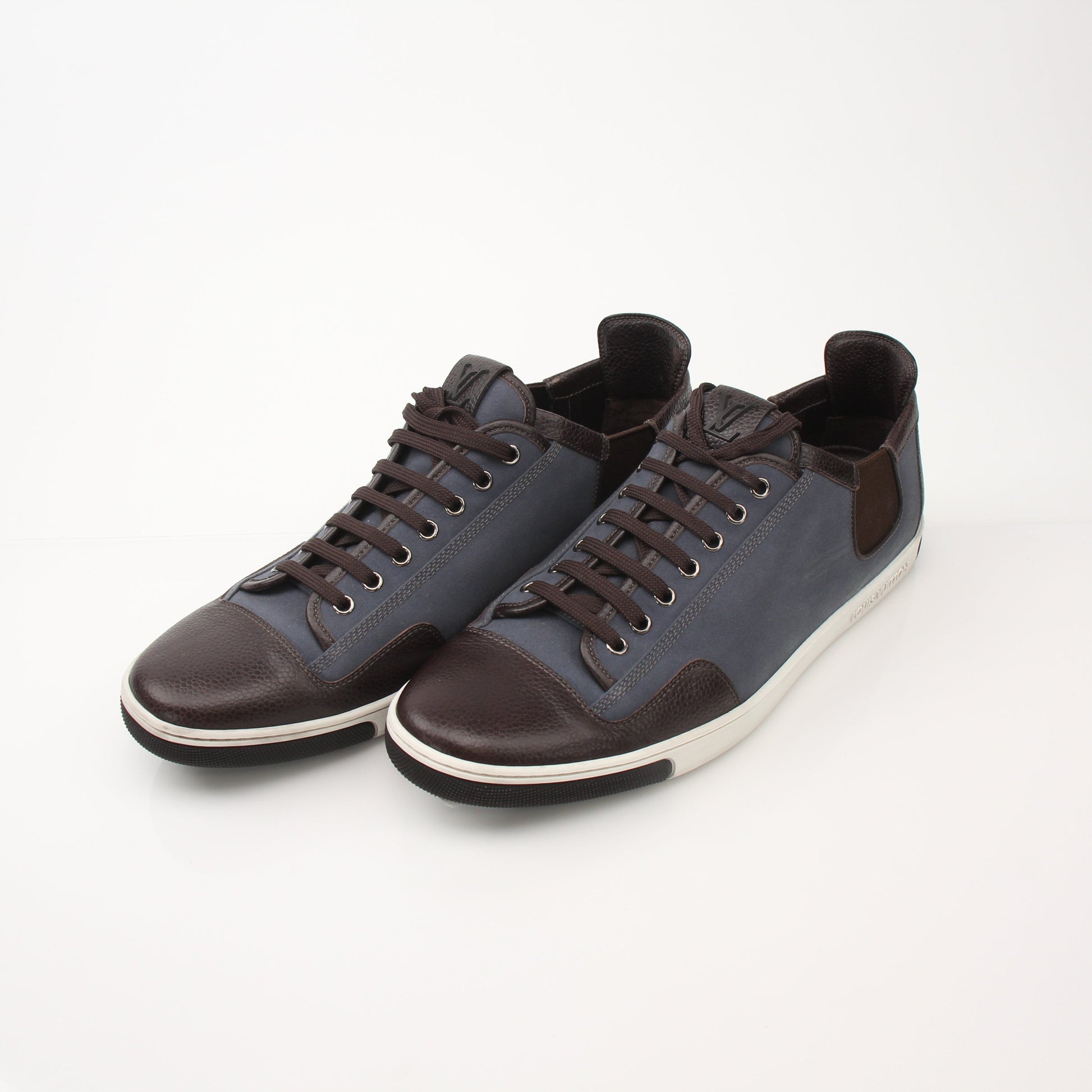 Louis Vuitton Men’s Shalom leather sneakers in black with white soles, stylish shoes from Gold & Beyond.