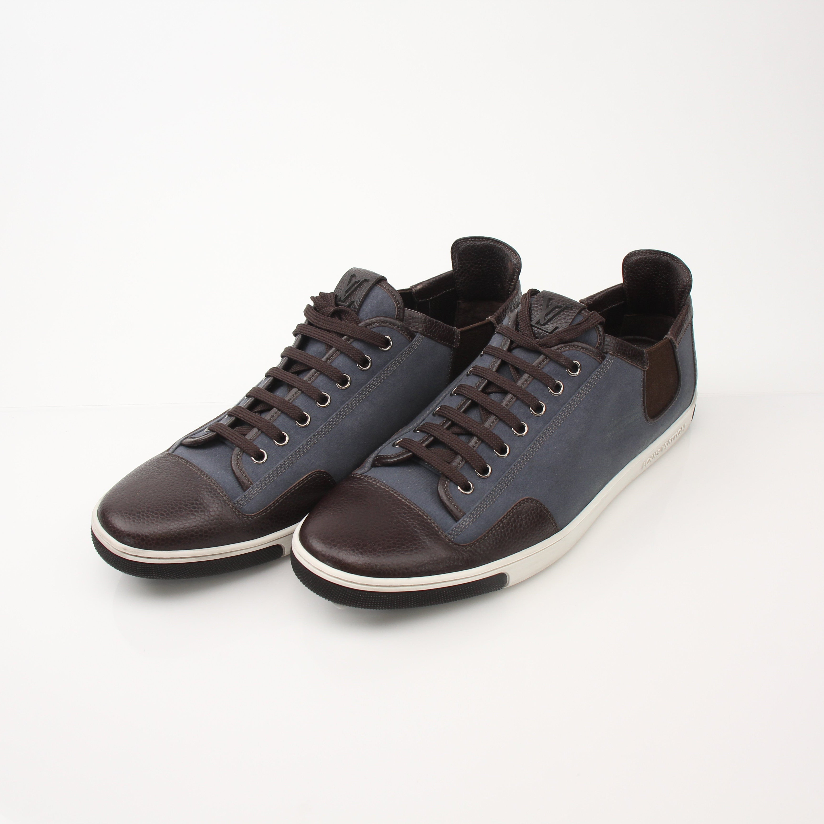Louis Vuitton Men’s Shalom leather sneakers in black with white soles, stylish shoes from Gold & Beyond.