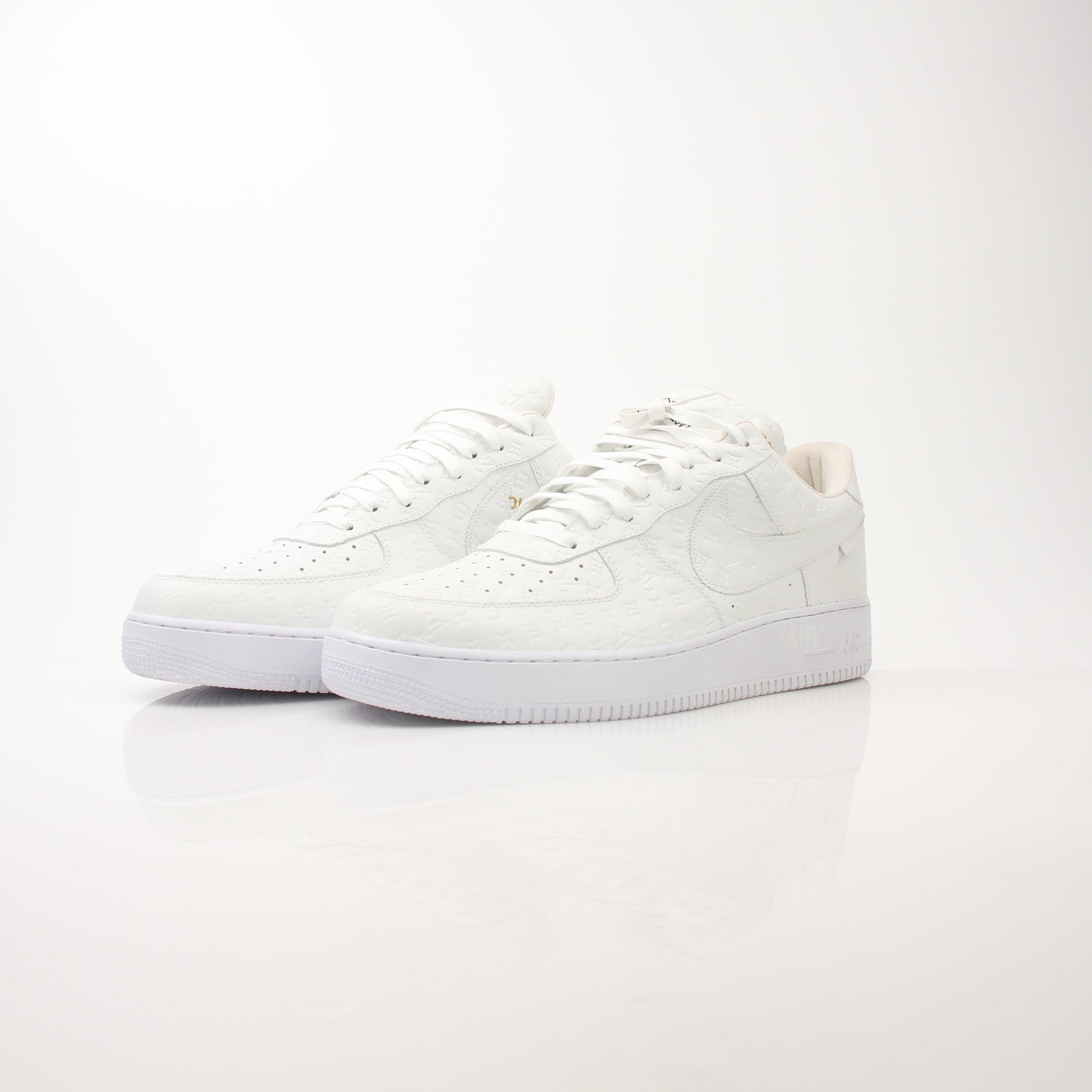 Louis Vuitton x Nike men's Air Force 1 Low sneakers in black with gold accents, featuring signature design details.