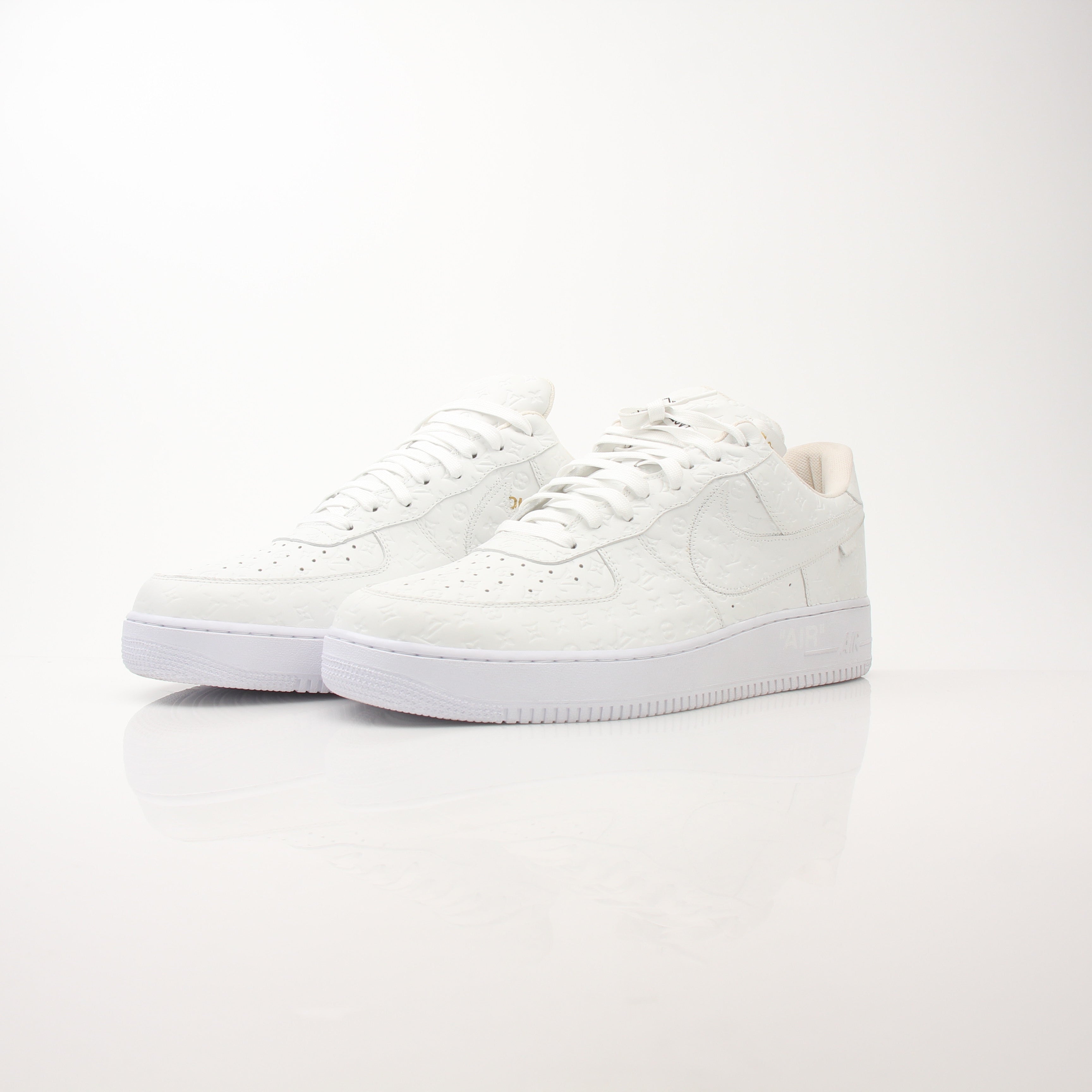 Louis Vuitton x Nike men's Air Force 1 Low sneakers in black with gold accents, featuring signature design details.