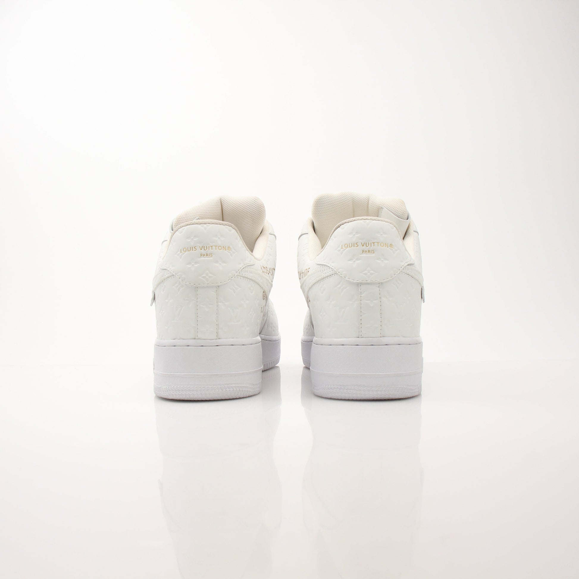 Louis Vuitton x Nike Men’s Air Force 1 Low sneakers in white with LV and Nike branding, stylish men's shoes from Gold & Beyond.