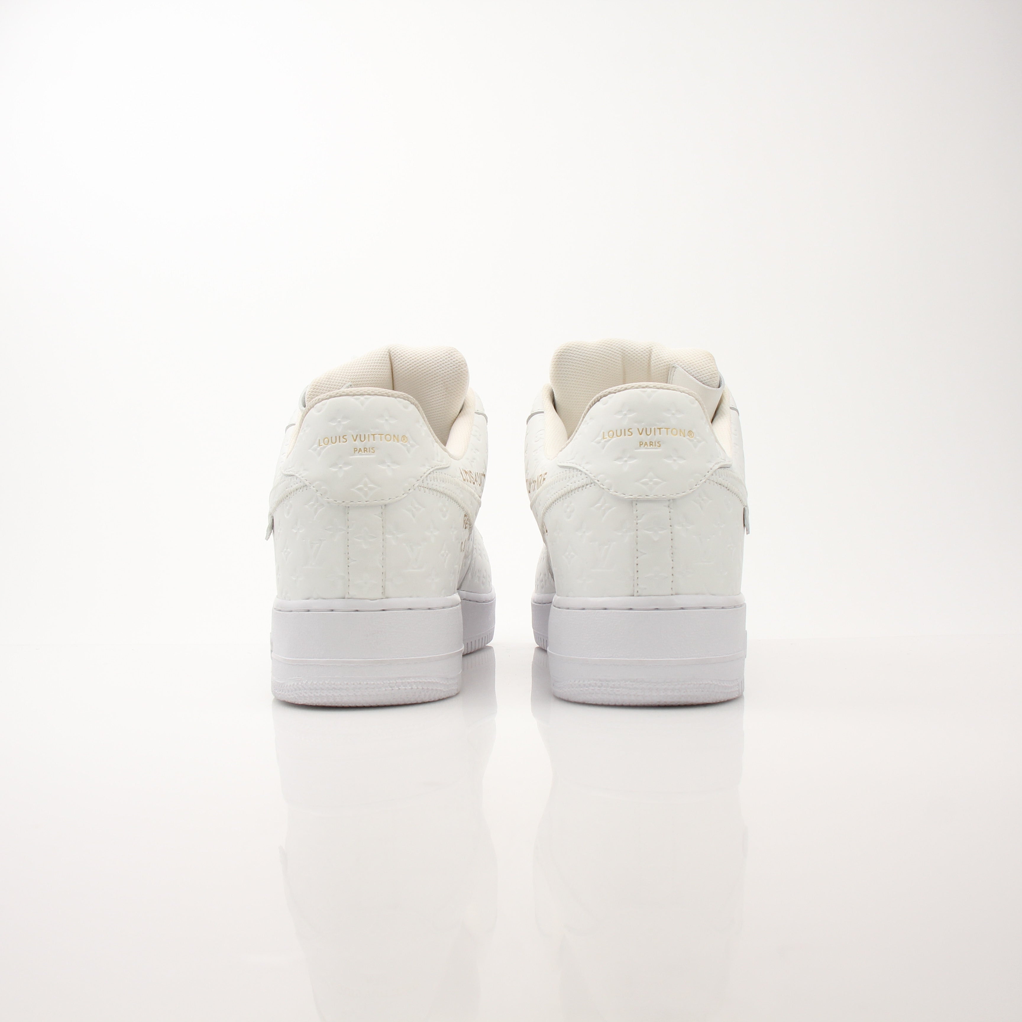 Louis Vuitton x Nike Men’s Air Force 1 Low sneakers in white with LV and Nike branding, stylish men's shoes from Gold & Beyond.