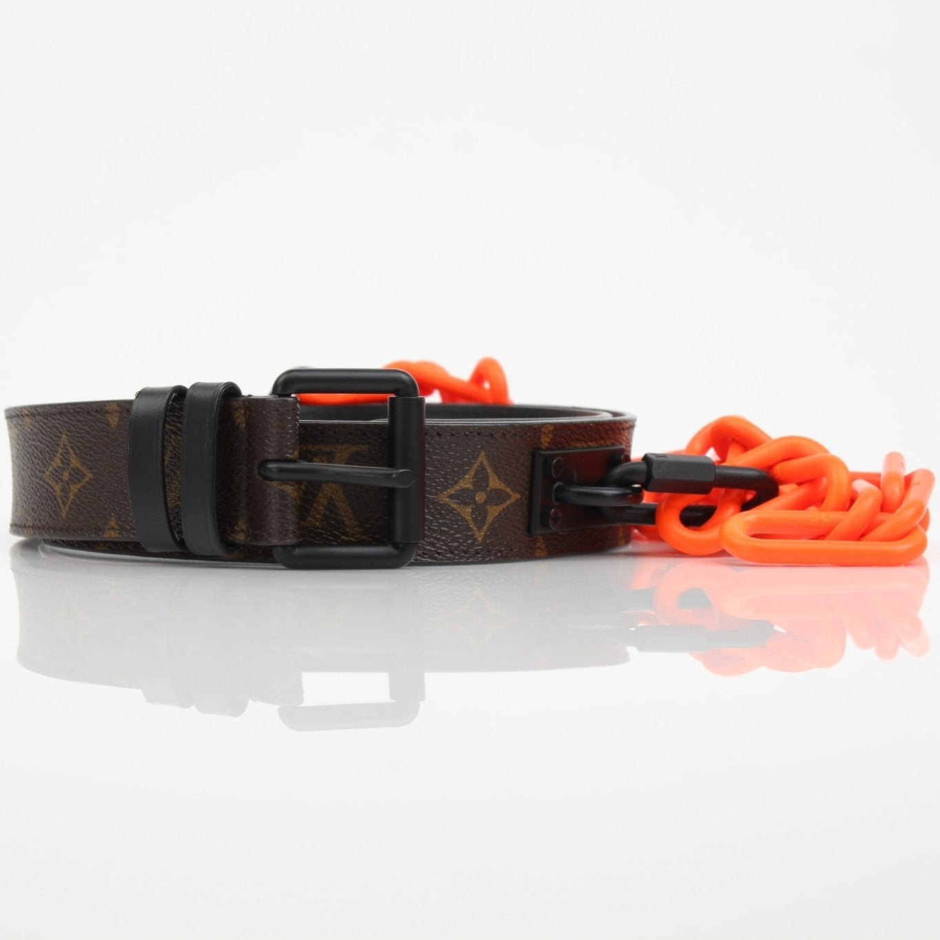Louis Vuitton Monogram Chain Belt in gold and brown leather, featuring the iconic LV monogram pattern and metal chain detailing.