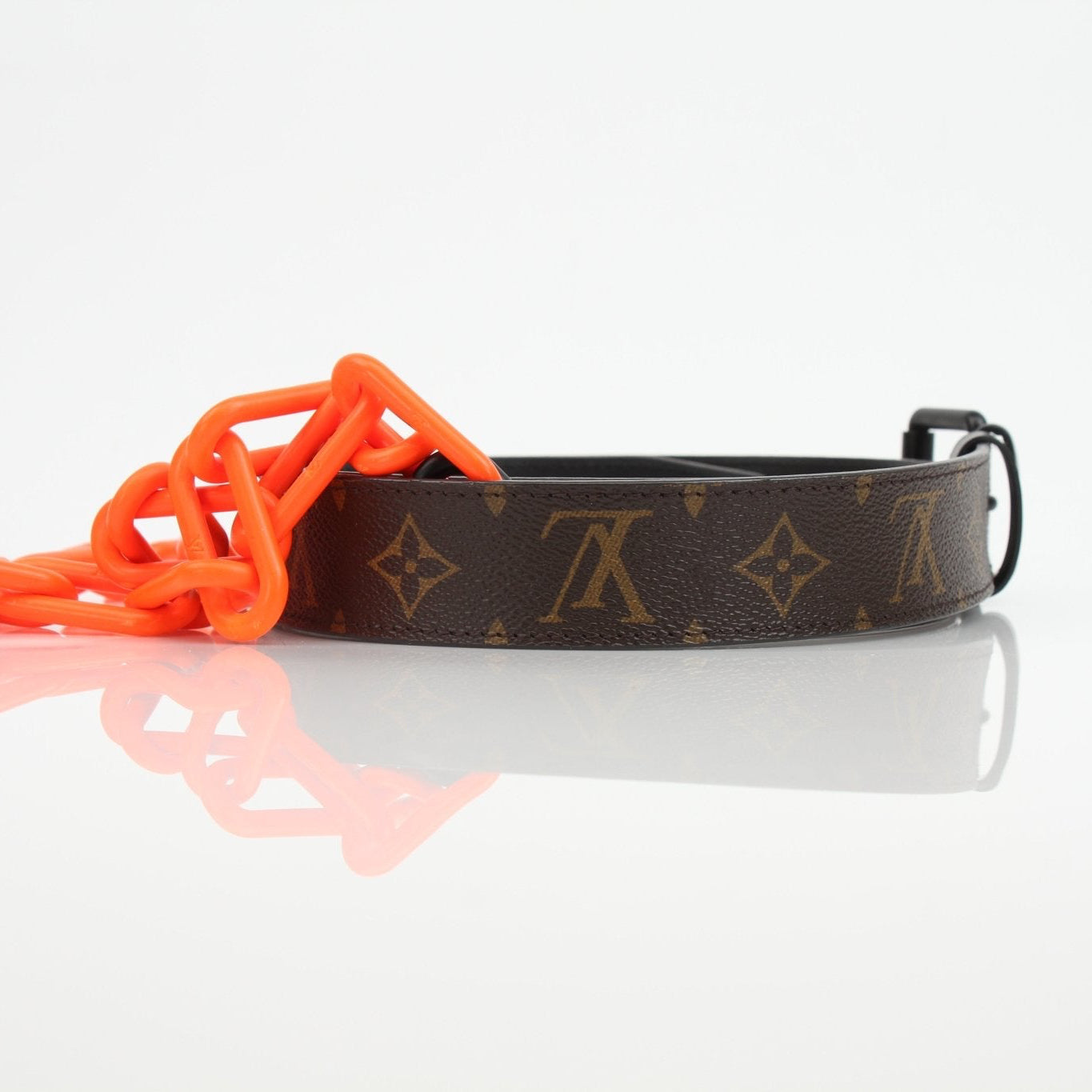 Louis Vuitton Monogram Chain Belt in gold and brown accessories with logo-embossed design from Gold & Beyond.