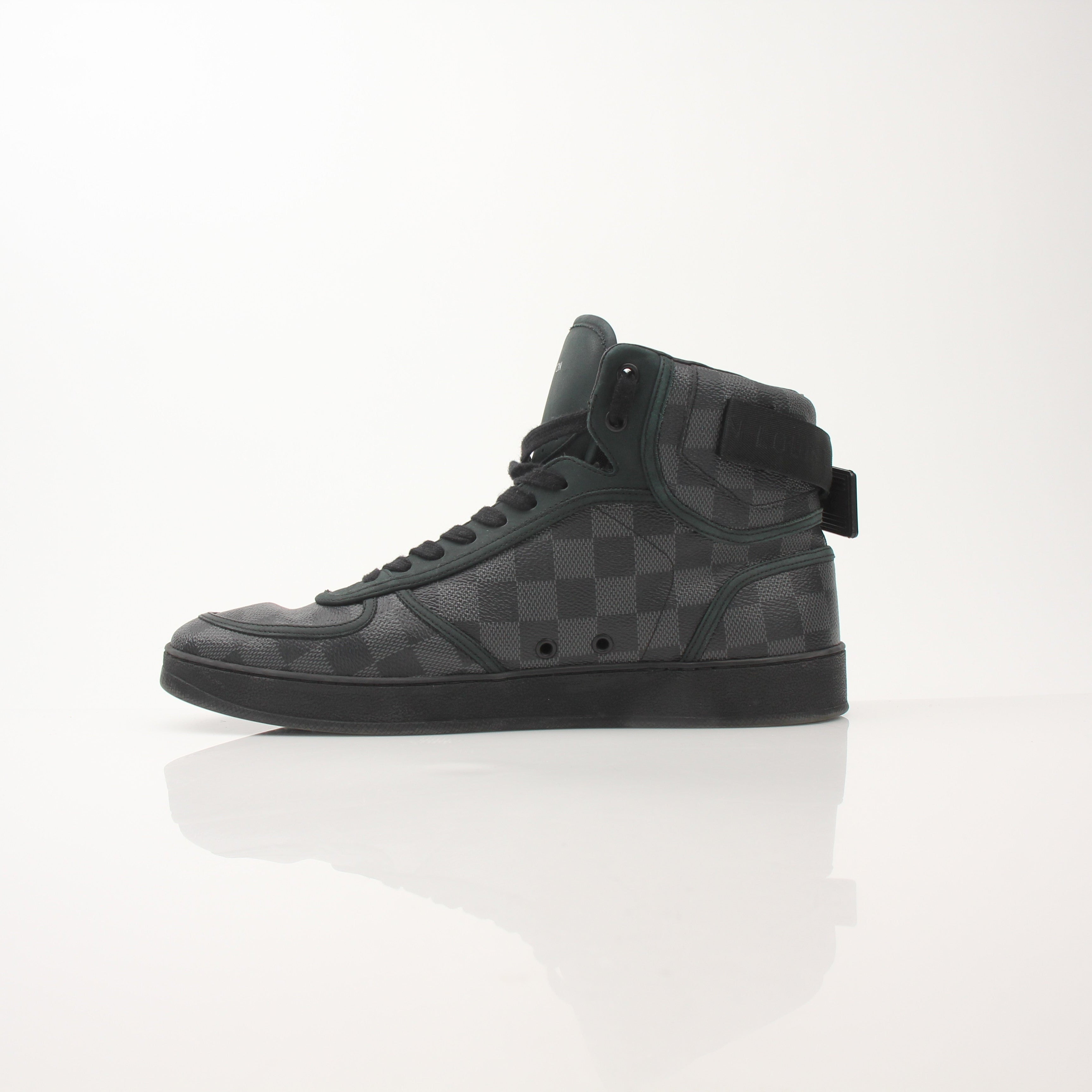 Louis Vuitton Rivoli high top sneakers for men, featuring black leather and gold accents, displayed on a neutral background.