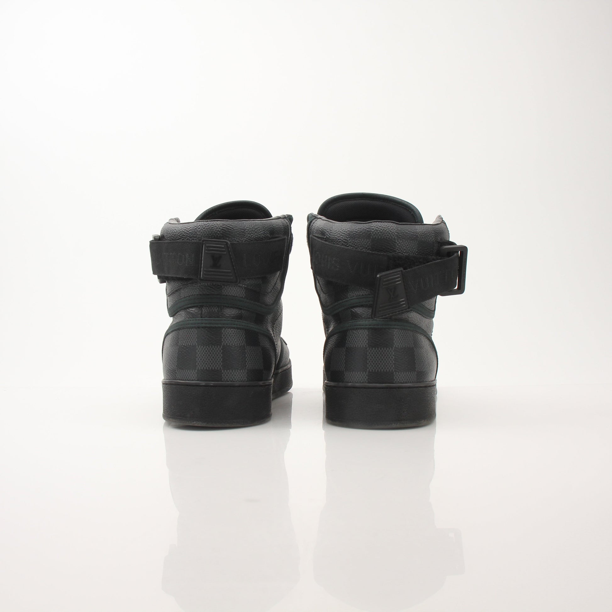 Louis Vuitton Men’s Rivoli high top sneakers by Gold & Beyond, showing black leather shoes with logo accents and white sole detail.