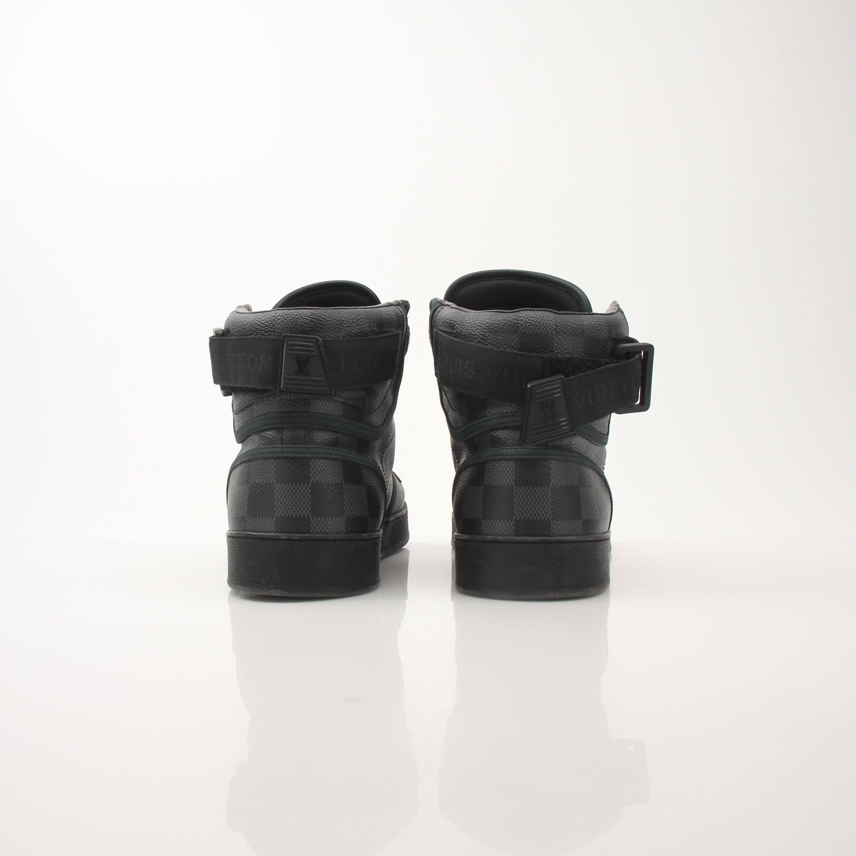 Louis Vuitton Men’s Rivoli high top sneakers by Gold & Beyond, showing black leather shoes with logo accents and white sole detail.