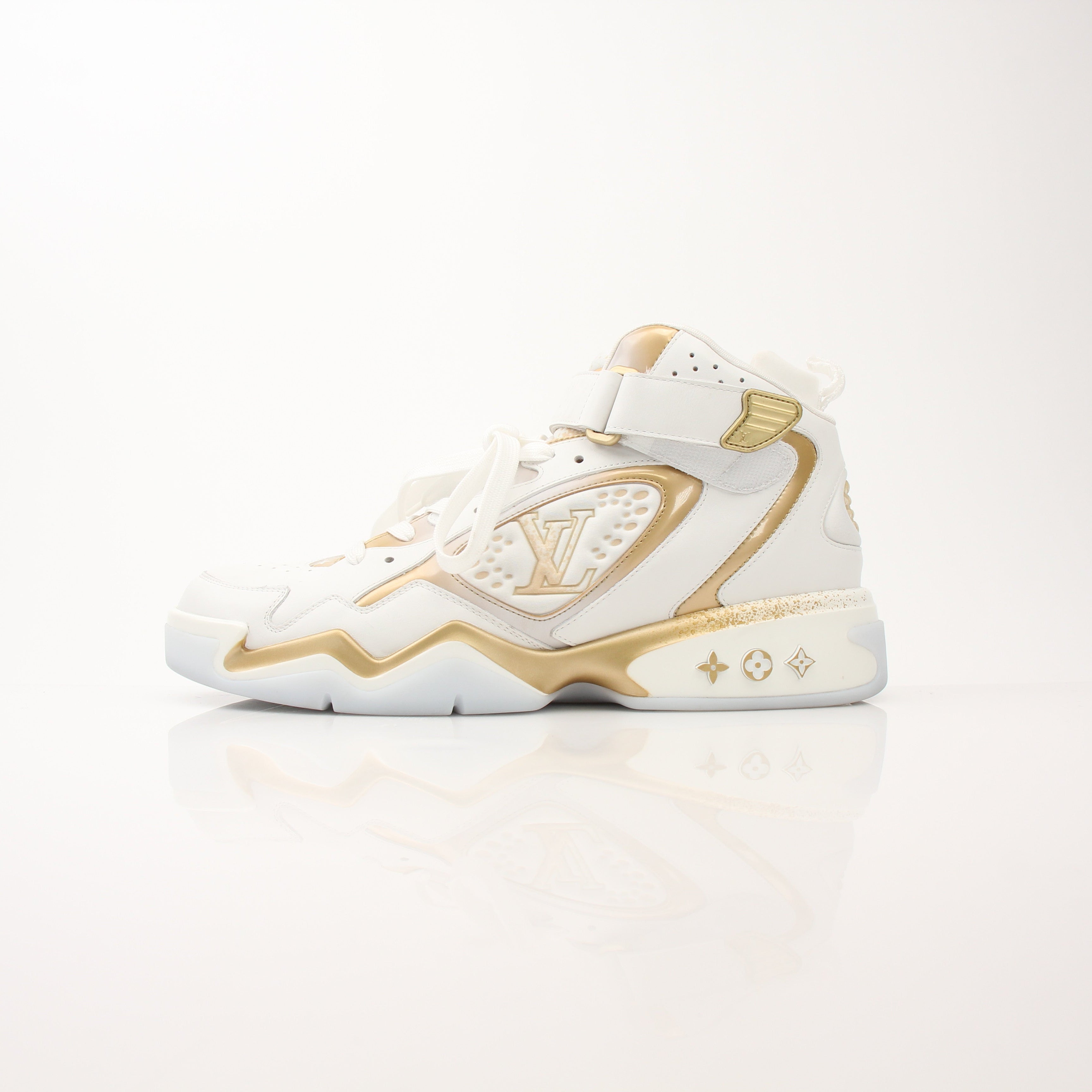 Louis Vuitton Men’s LV Trainer 2 sneakers in black and white with gold accents, stylish shoe design by Gold & Beyond.