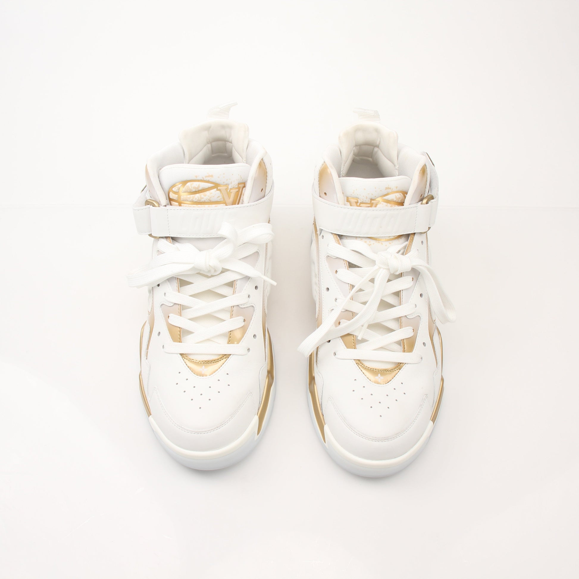 Louis Vuitton Men’s LV Trainer 2 sneakers in black and brown with logo details, displayed on a white background.