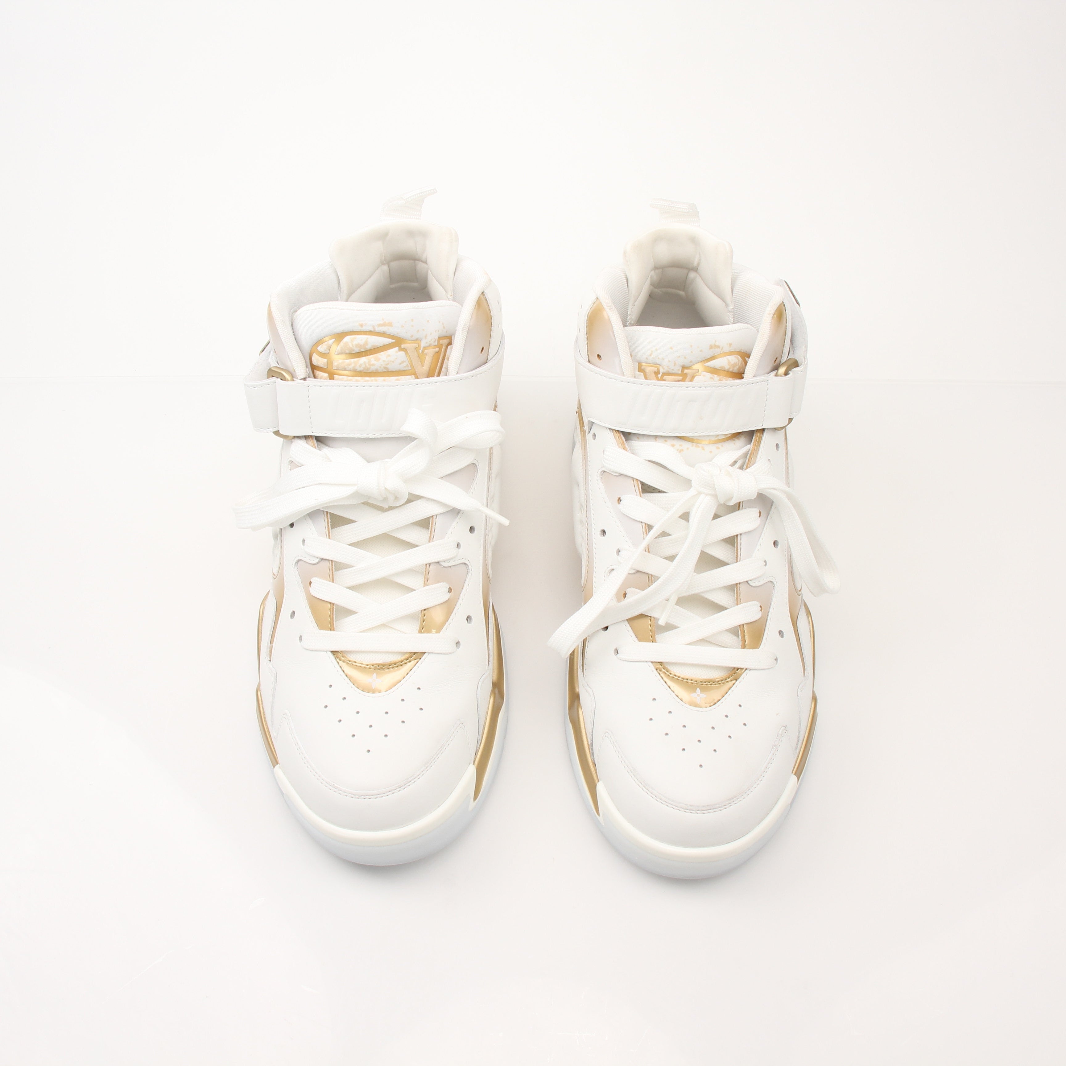 Louis Vuitton Men’s LV Trainer 2 sneakers in black and brown with logo details, displayed on a white background.