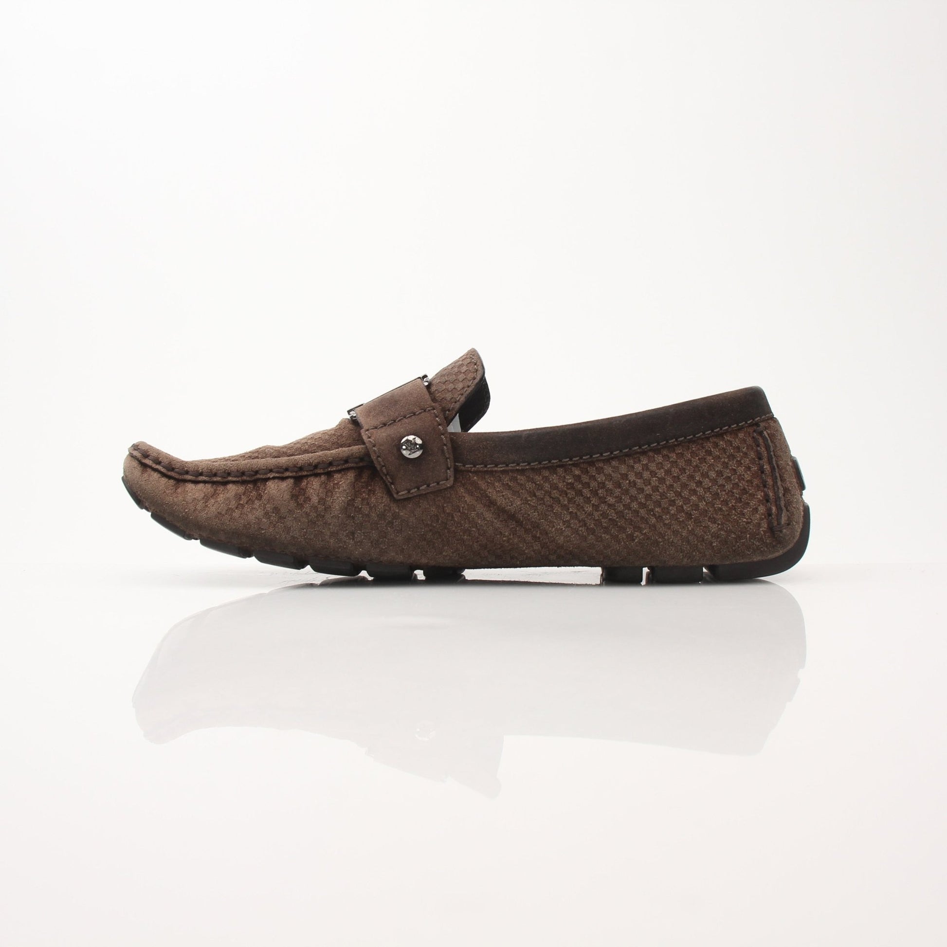 Gold & Beyond Louis Vuitton Hockenheim Moccasin shoes, close-up of black leather slip-on footwear with detailed stitching.