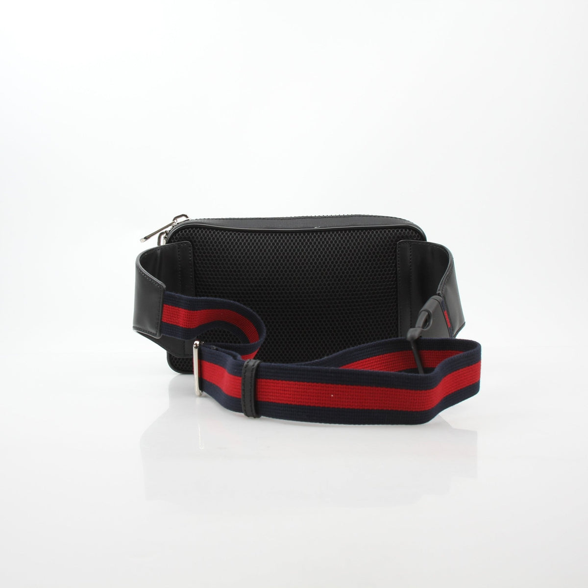 Gucci black GG Supreme web belt bag with adjustable strap and gold-tone hardware, casual handbag accessory.