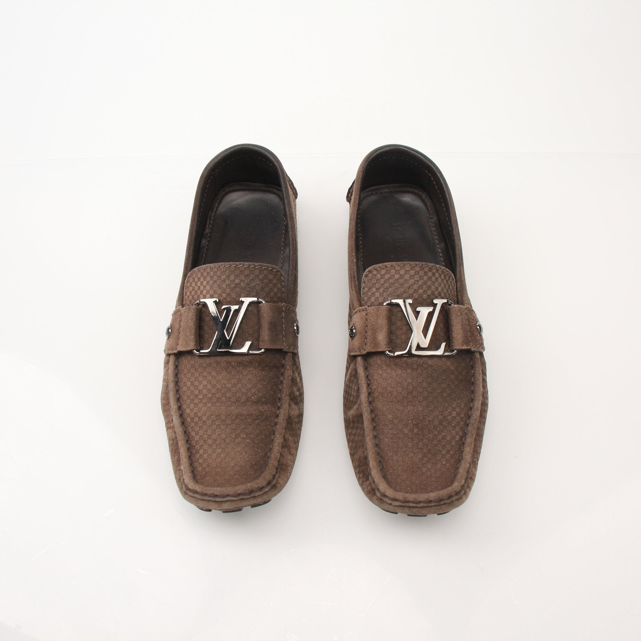 Gold & Beyond Louis Vuitton Hockenheim Moccasin shoes in tan leather, shown with detailed stitching and classic loafer design.
