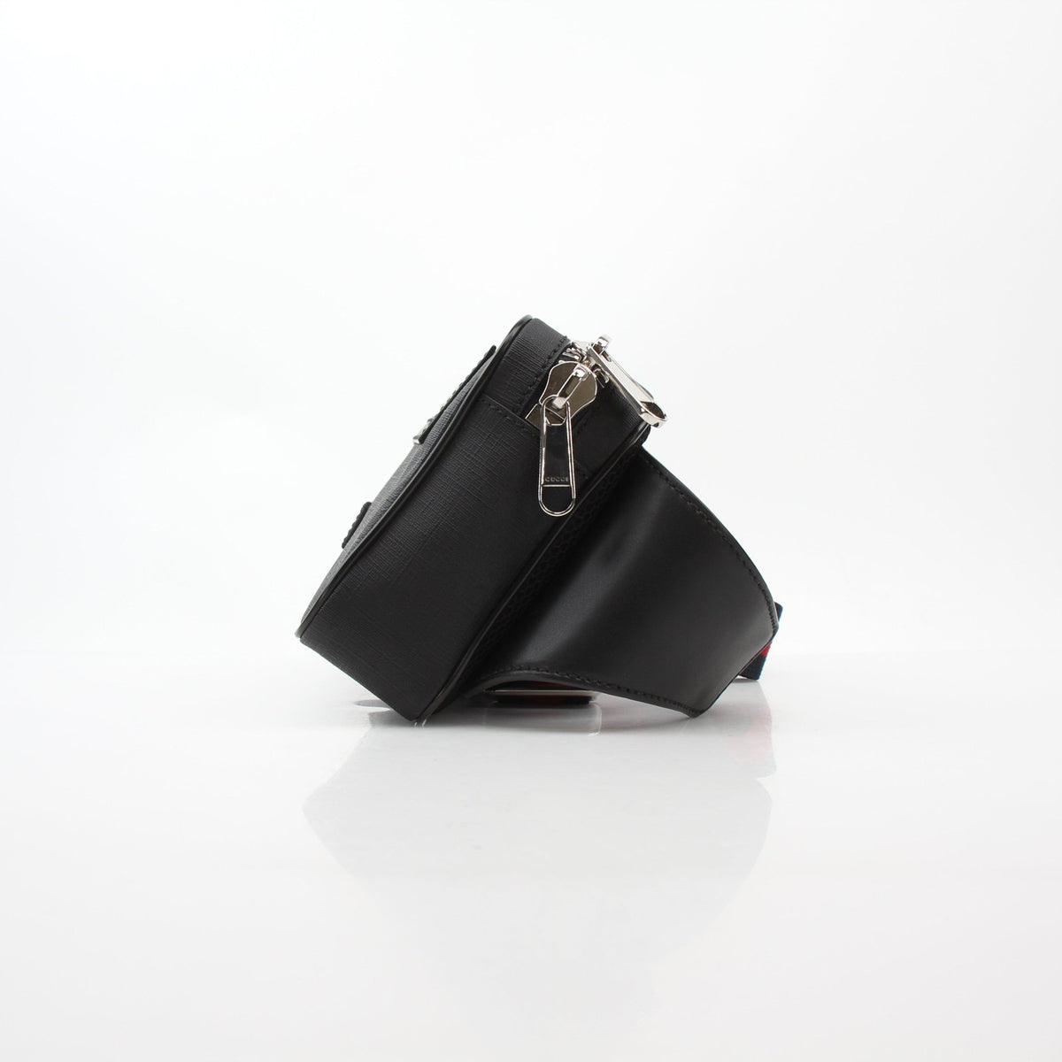 Gucci black GG Supreme web belt bag with adjustable strap and gold hardware, casual accessory for daily wear.