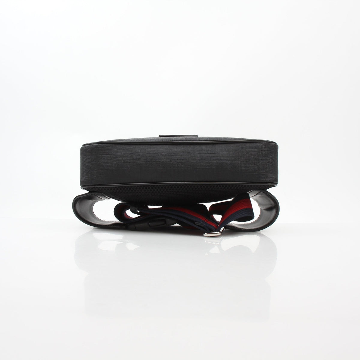 Gucci black GG Supreme web belt bag with adjustable strap and gold-tone hardware, shown from front view.