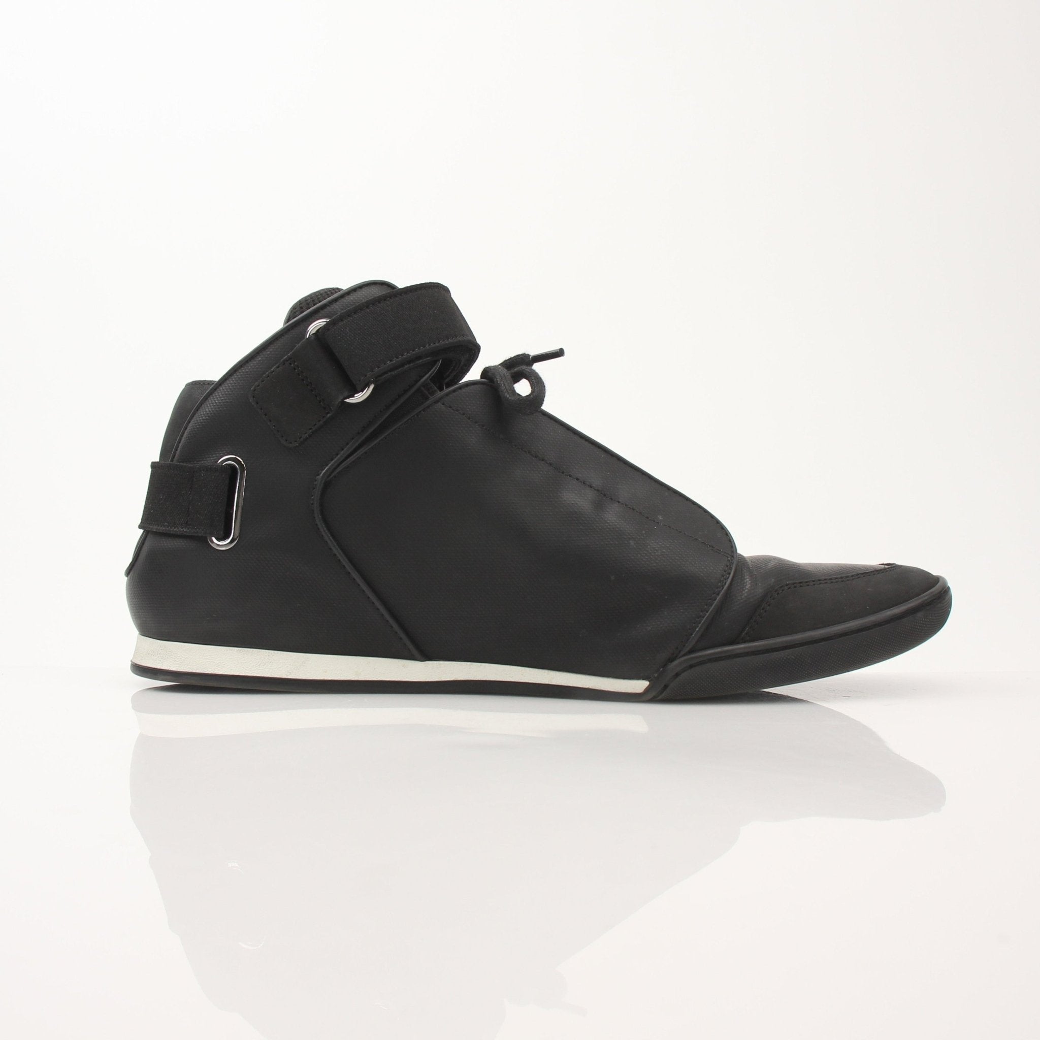 Louis Vuitton men's black mid-top sneakers with stylish design and leather accents, paired with casual and sporty outfits.