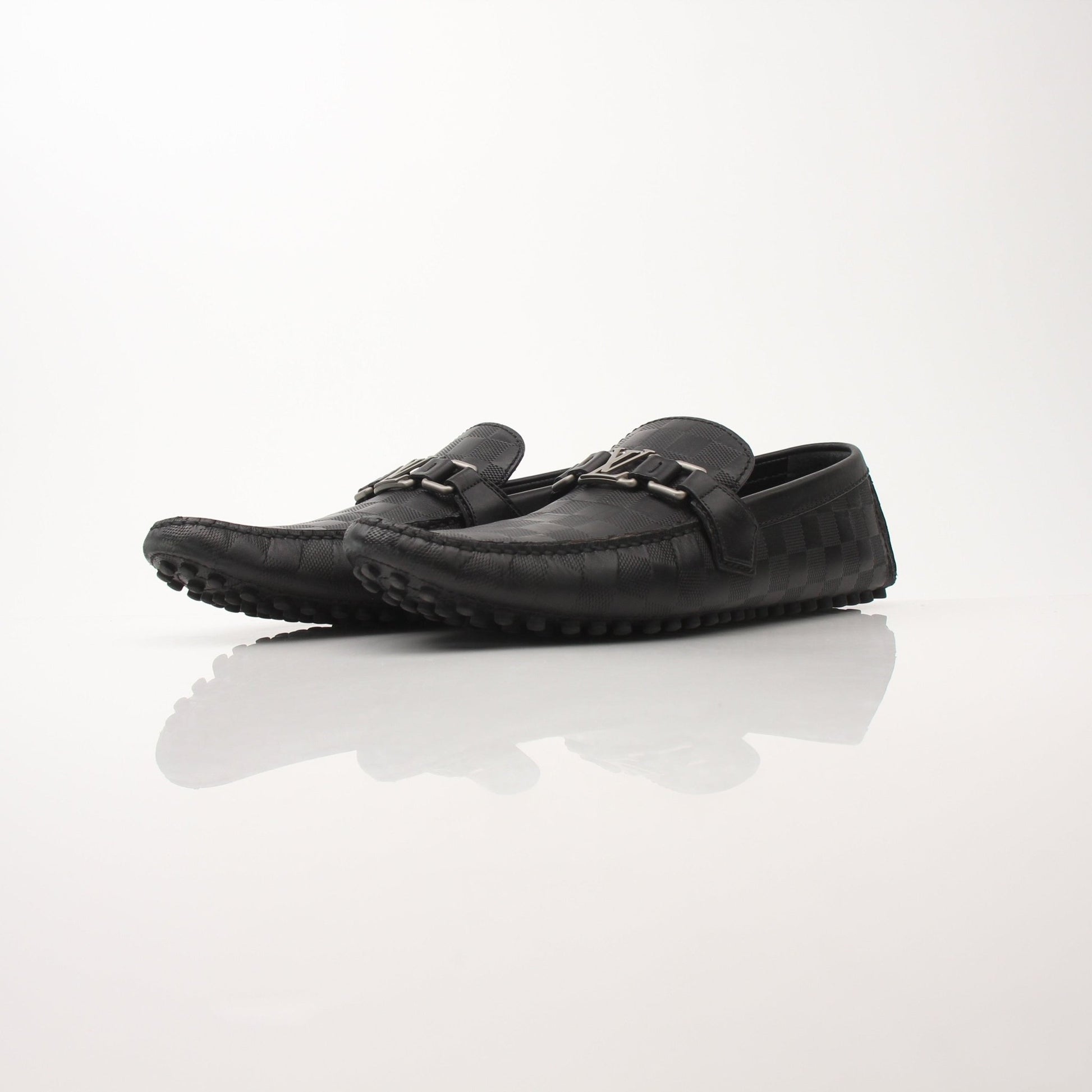 Gold & Beyond Louis Vuitton Hockenheim Moccasin shoes, stylish leather footwear with detailed stitching and classic design.
