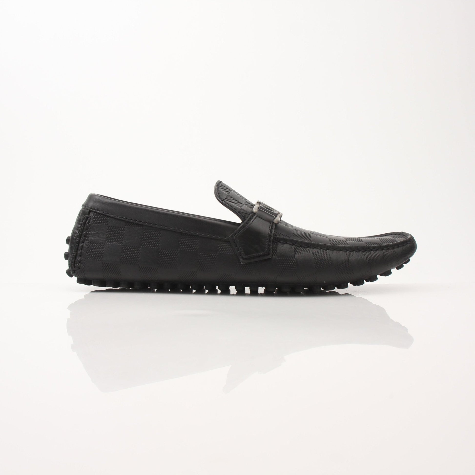 Gold & Beyond Louis Vuitton Hockenheim Moccasin shoes, stylish brown leather footwear with detailed stitching and classic design.