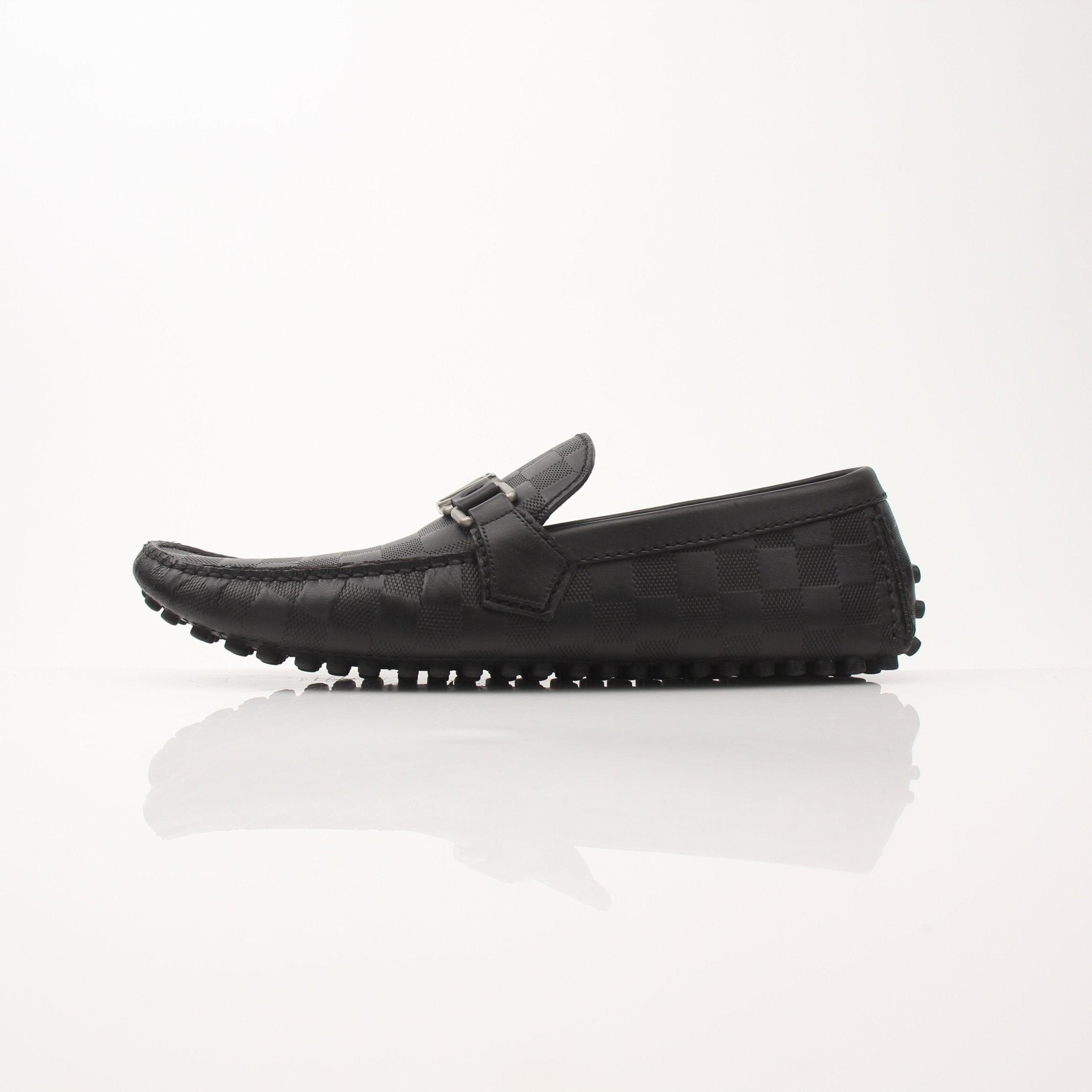 Gold & Beyond Louis Vuitton Hockenheim Moccasin shoes, stylish men's footwear with detailed leather craftsmanship.