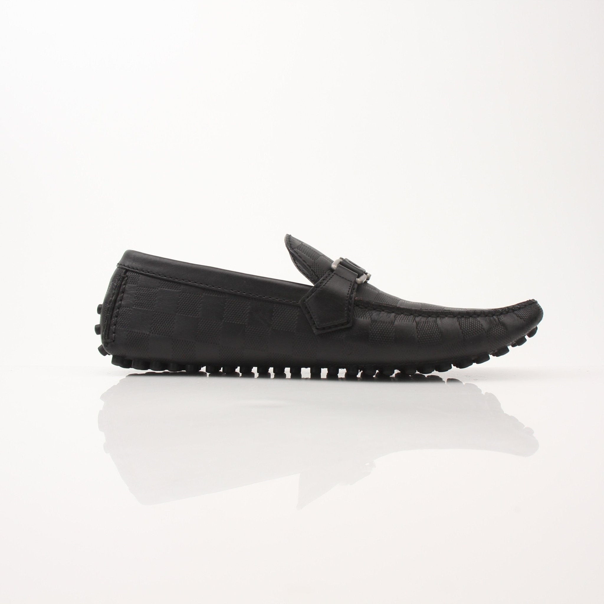 Gold & Beyond Louis Vuitton Hockenheim Moccasin shoes displayed on a plain background.