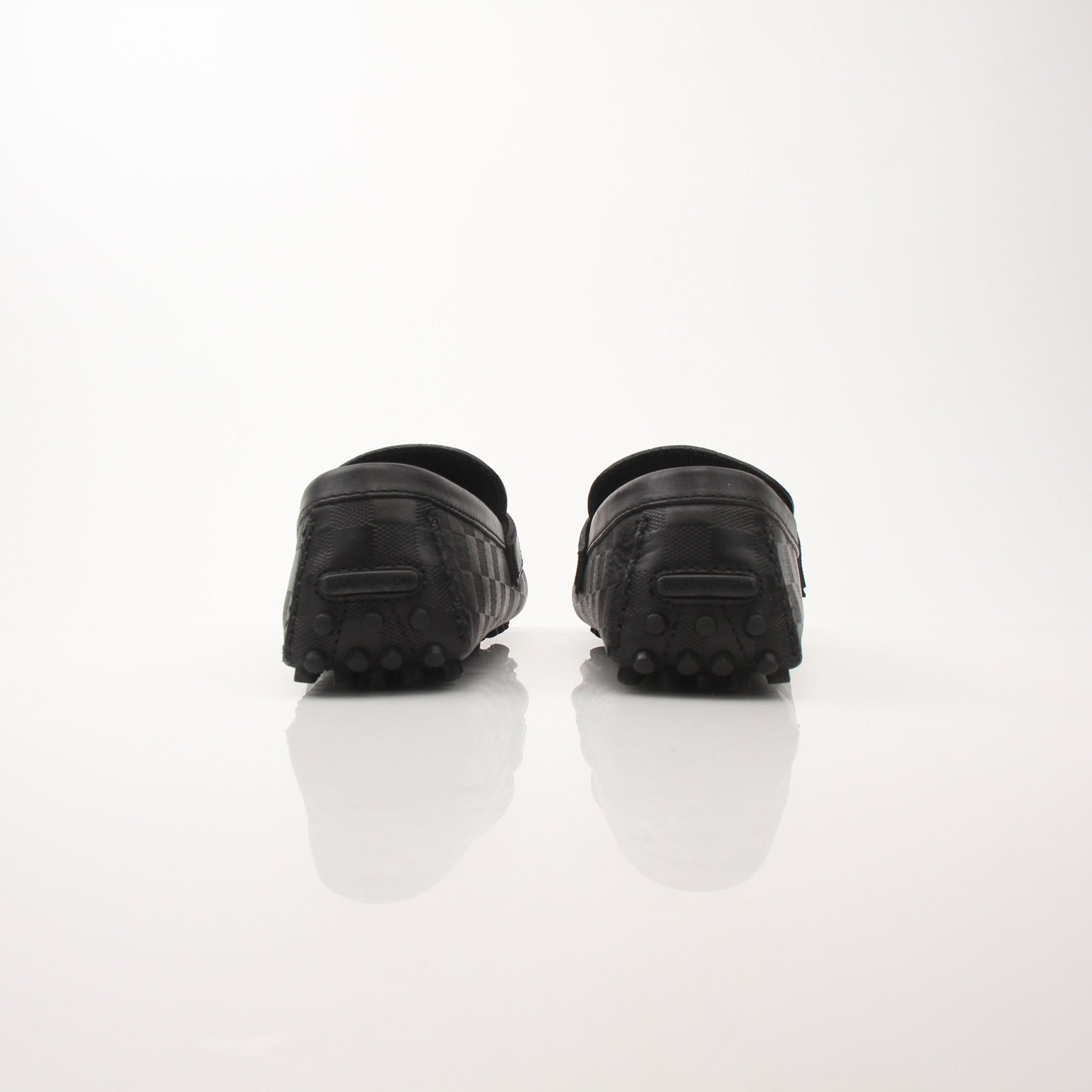 Gold & Beyond Louis Vuitton Hockenheim Moccasin shoes featuring classic design and premium leather craftsmanship.
