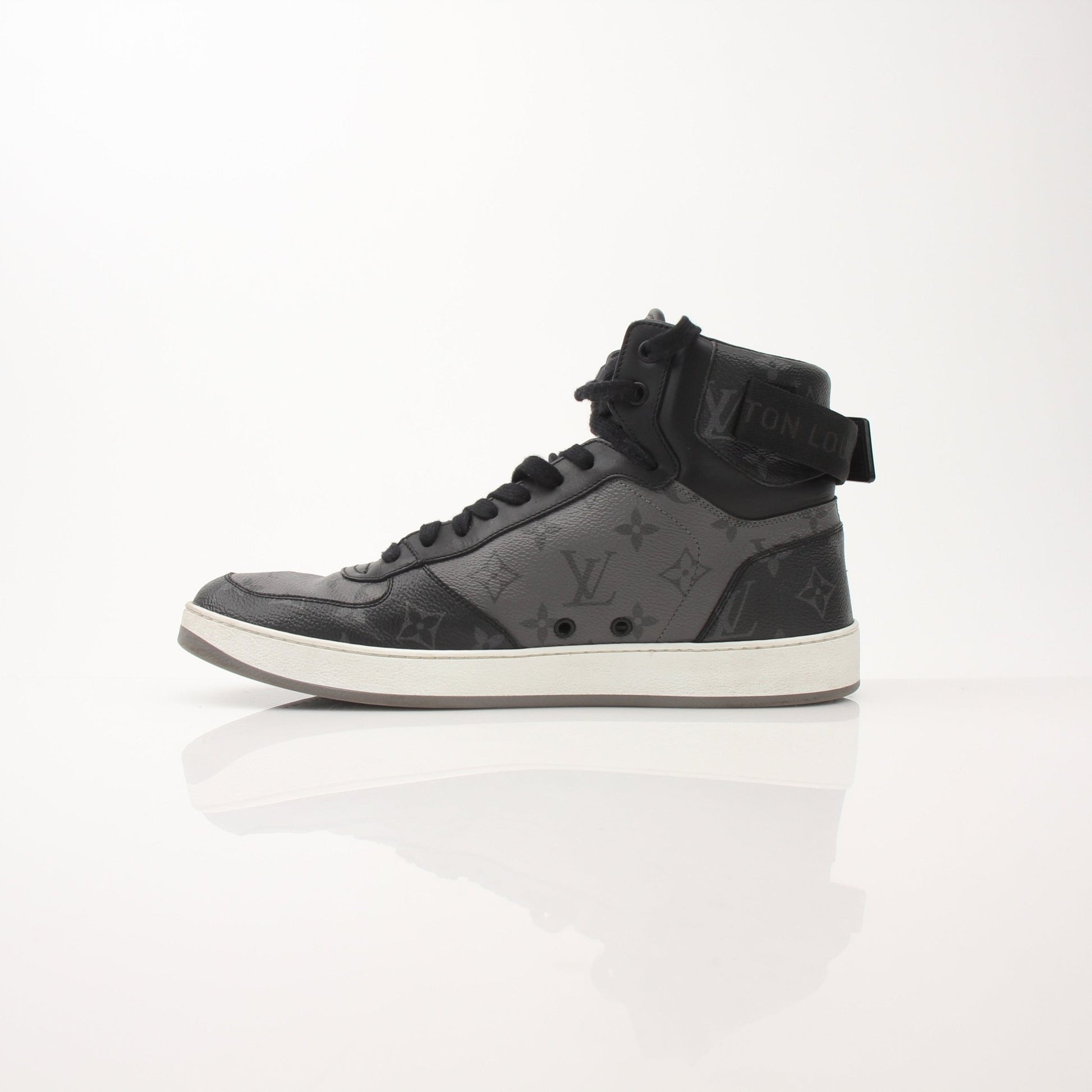 Gold & Beyond Louis Vuitton Rivoli Trainers shoes with white and black design, showcasing stylish sneakers with branding details.