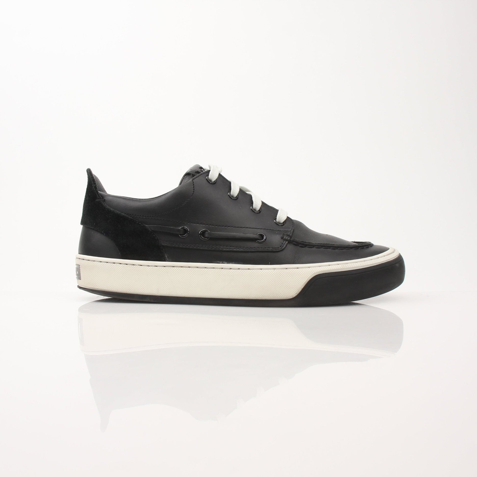 Louis Vuitton Damier Low Top Sneakers featuring classic checkerboard design and white rubber sole, by Gold & Beyond.